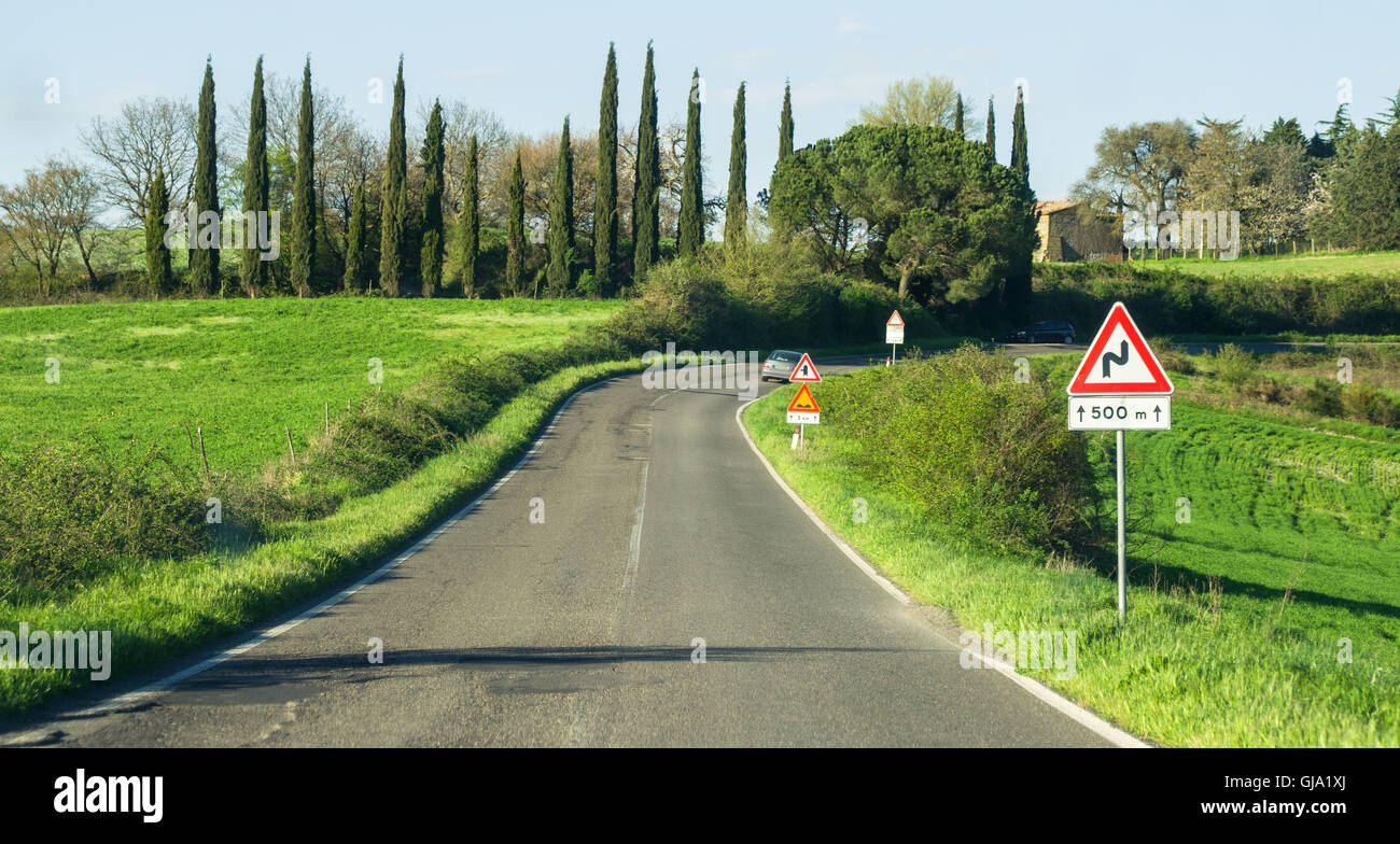 road bends road sign that indicates the curve Stock Photo