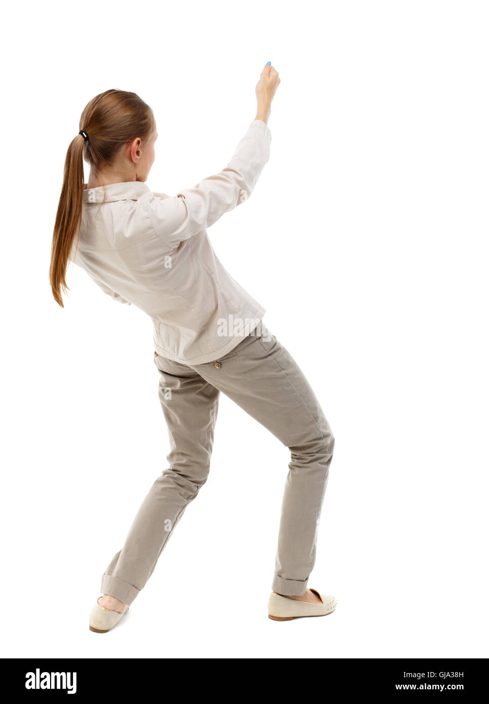 Girl Standing With Rope back view of standing girl pulling a rope from top or cling to s Stock ...
