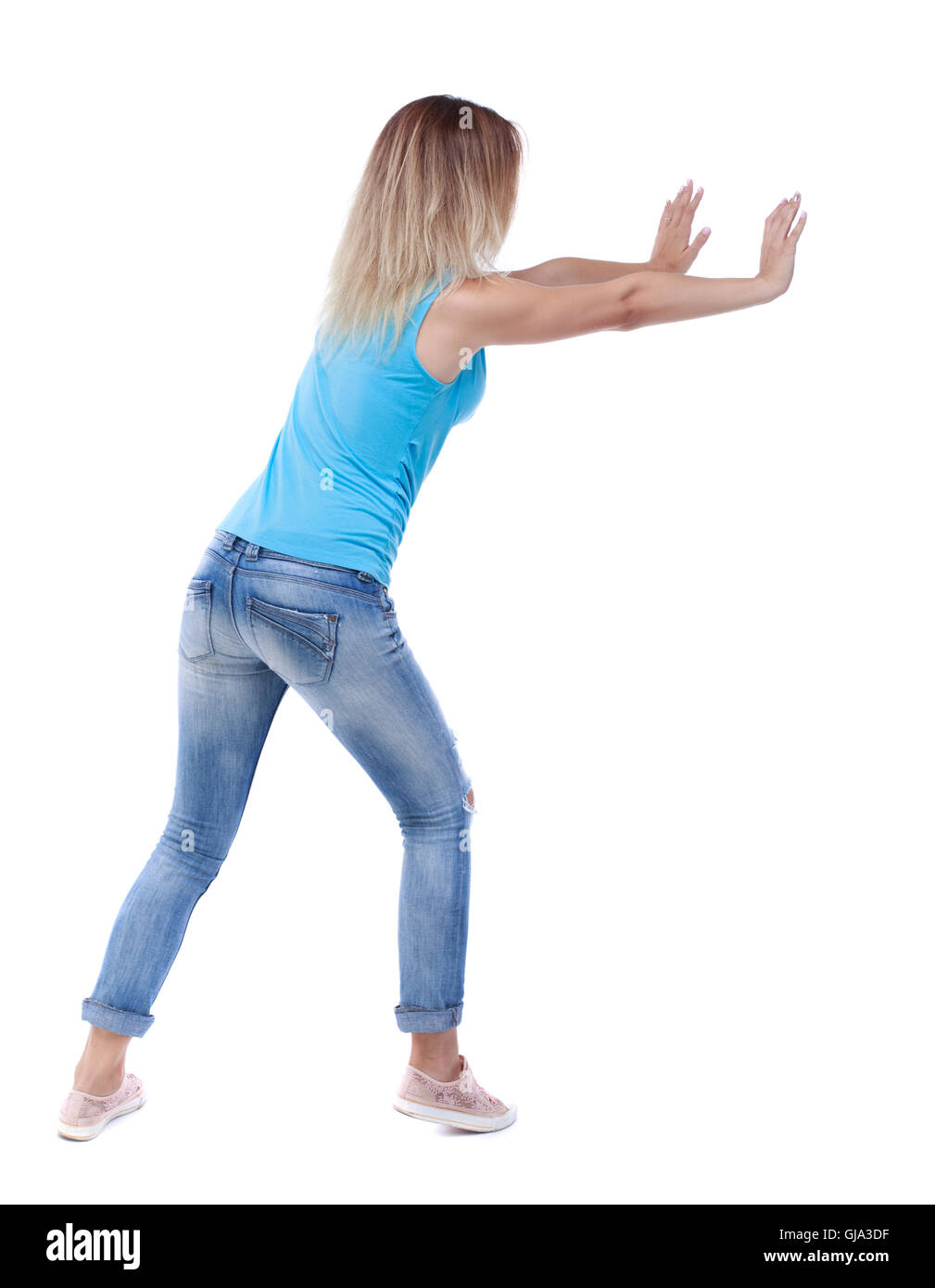 Pushing Back View back view of woman pushes wall Stock Photo - Alamy