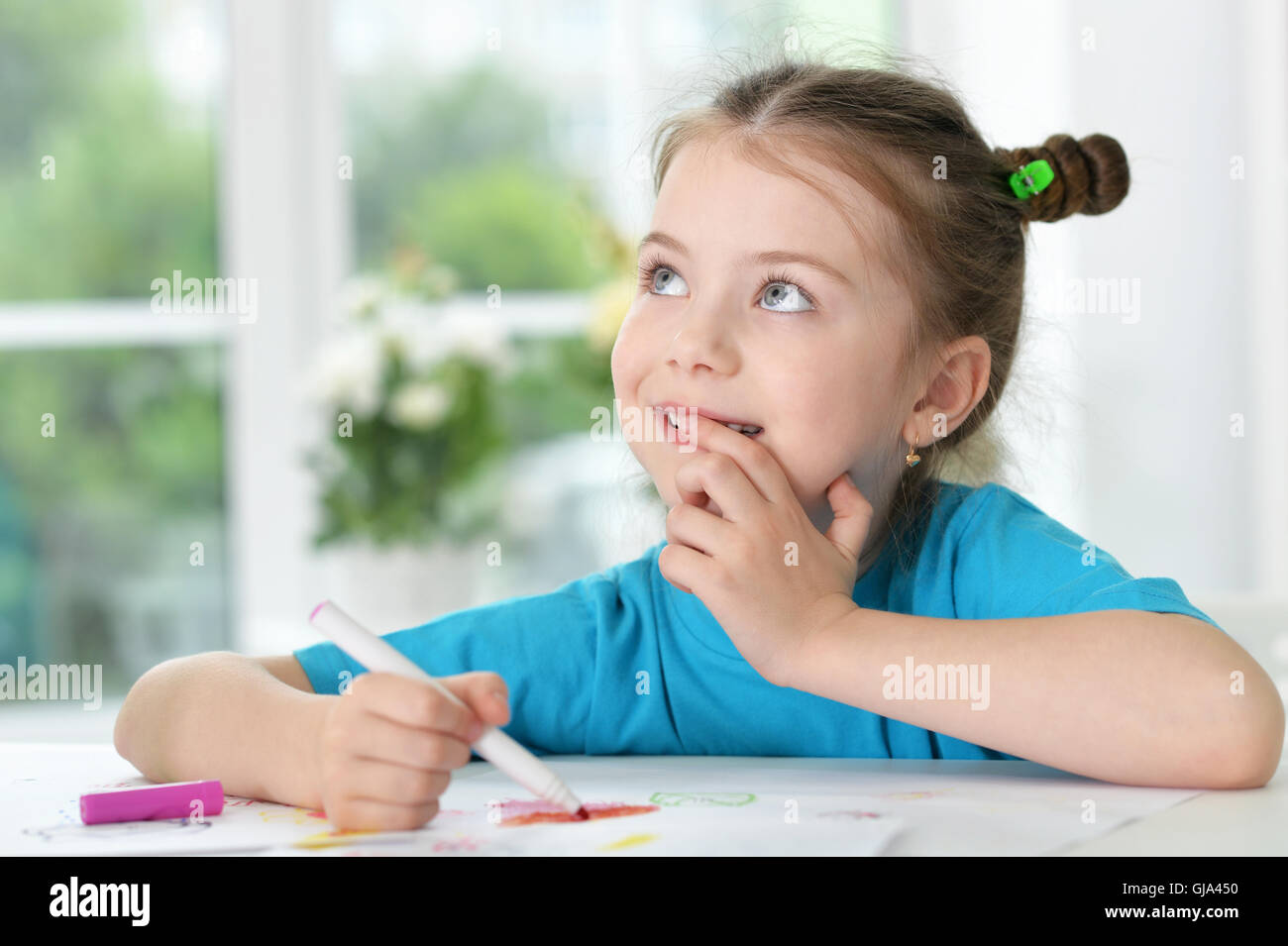 Little girl drawing at class Stock Photo - Alamy