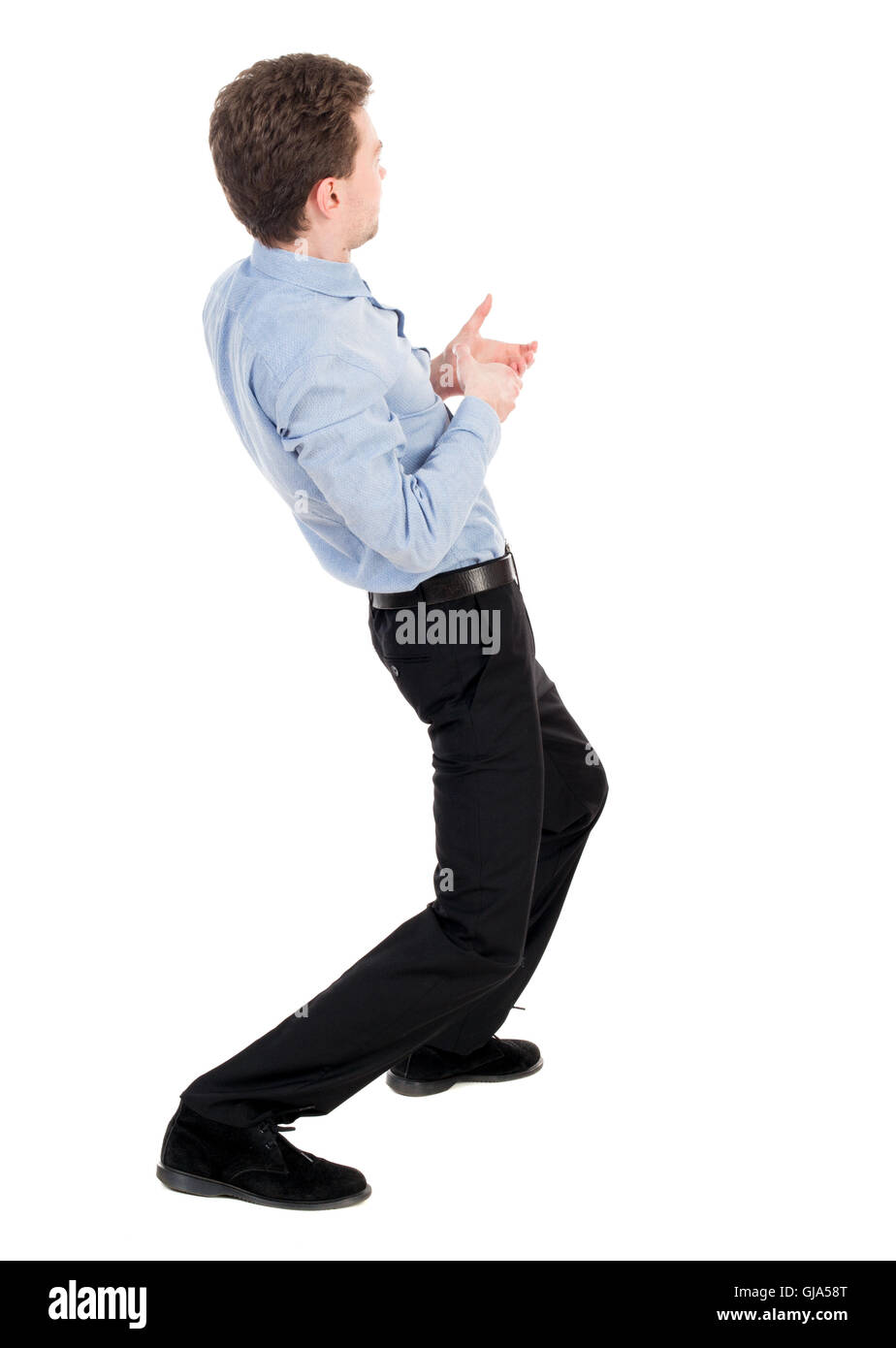 back view of standing man pulling a rope from the top or cling t Stock  Photo - Alamy