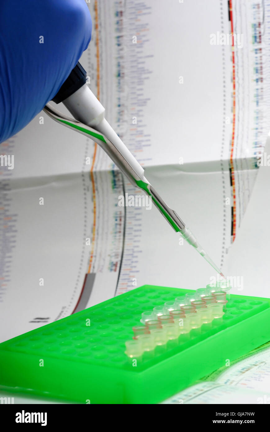 DNA research with graphics charts reference in the background Stock Photo