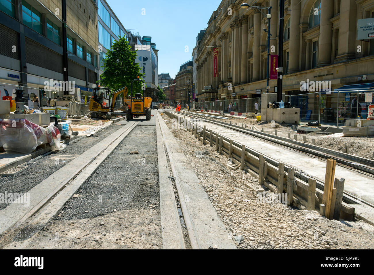 Tram tracks being laid along Cross Street, Manchester, England, UK, during construction of a 2nd line through the city centre. Stock Photo