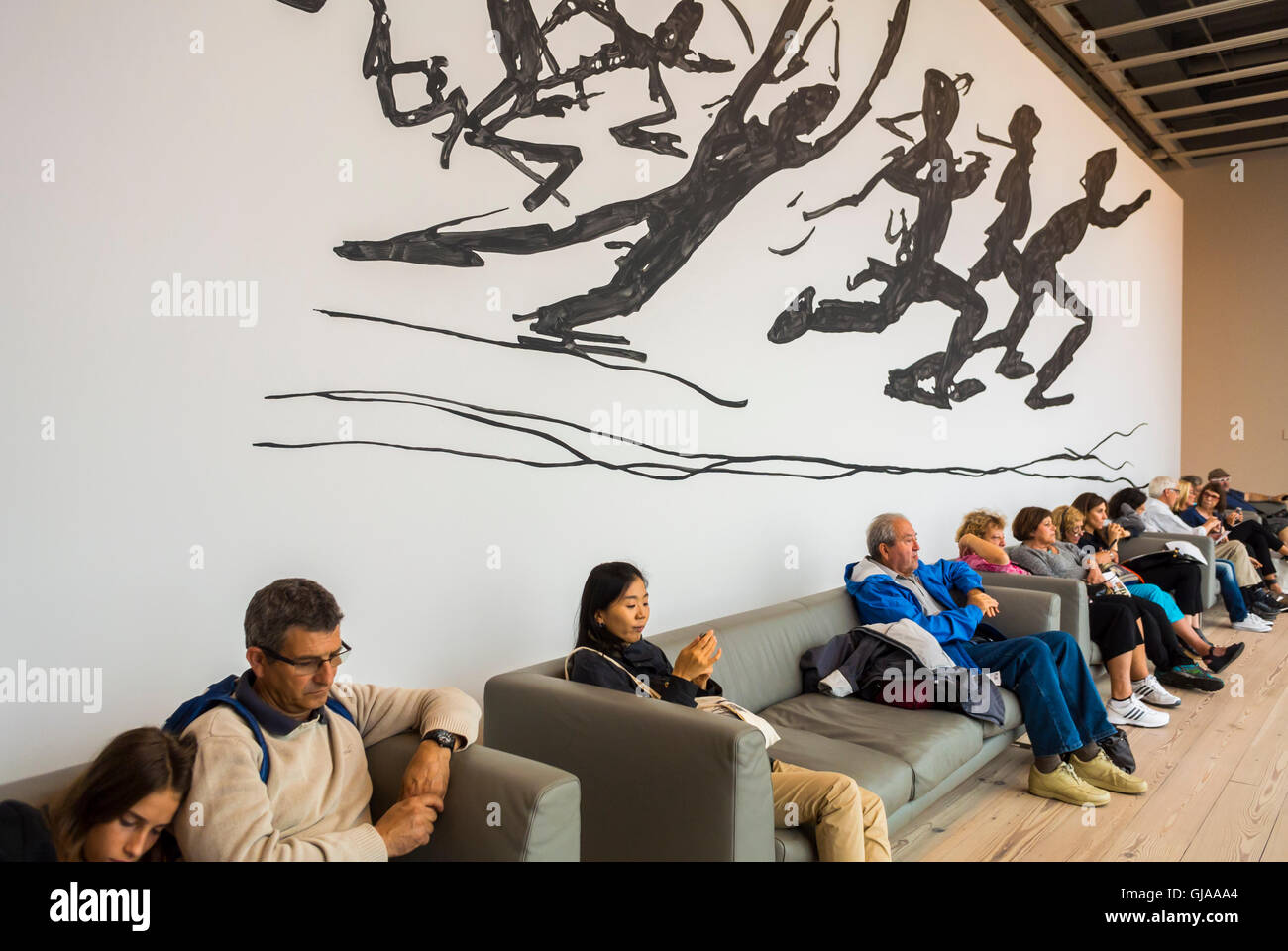 New York, NY, USA, Group of Tourists Visiting, Sitting in Lounge with Graphic Wall Mural, in Modern American Art Museum, Downtown Whitney Museum, in Meat Packing District Neighborhood Stock Photo