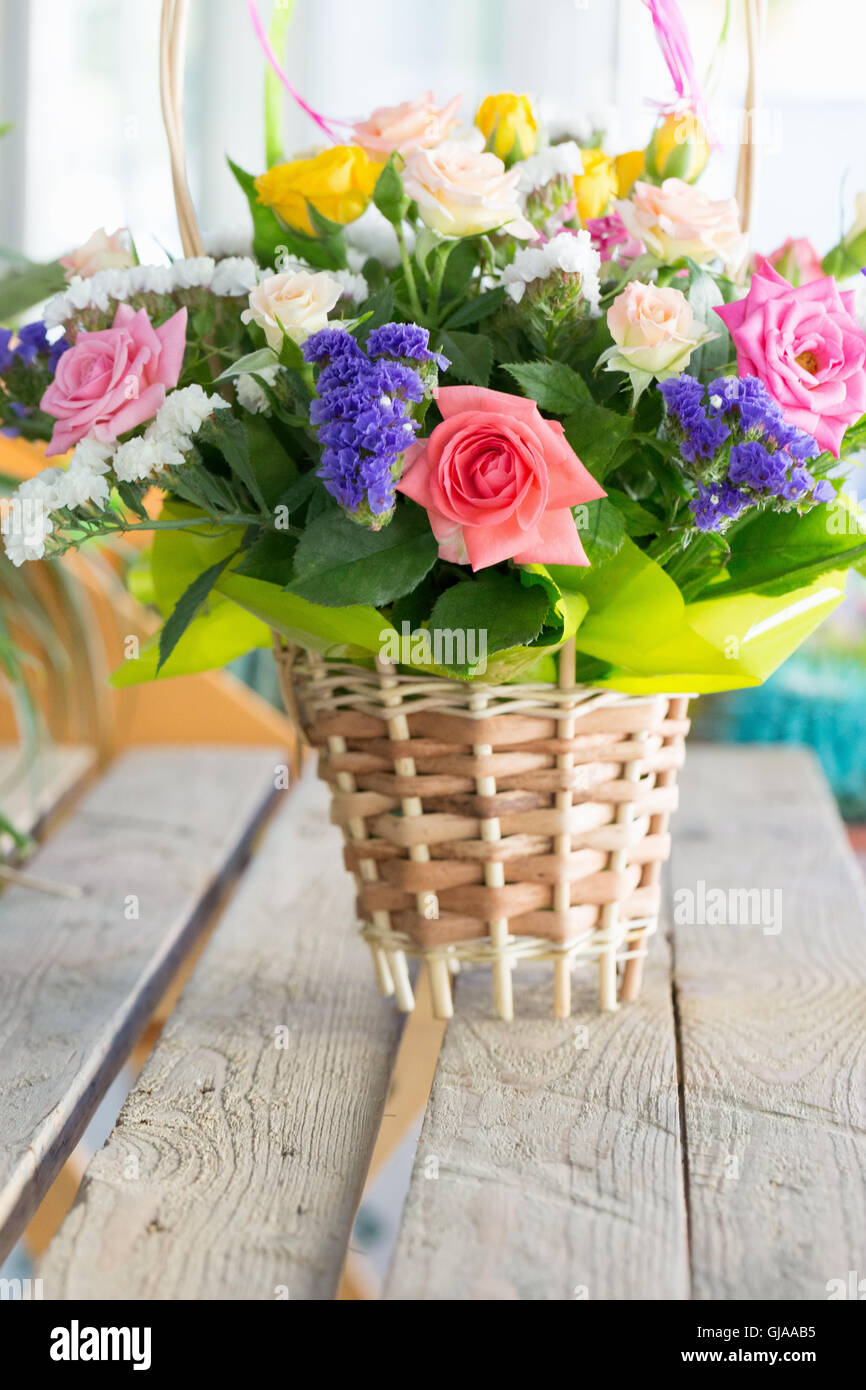 bouquet of flowers in a wicker basket Stock Photo - Alamy