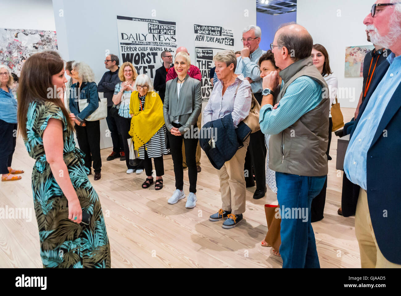 New York City, NY, USA, Crowd of Tourists Listening to Tour Guide leading group in Modern American Art Gallery, Downtown Whitney Museum, women giving talk Stock Photo