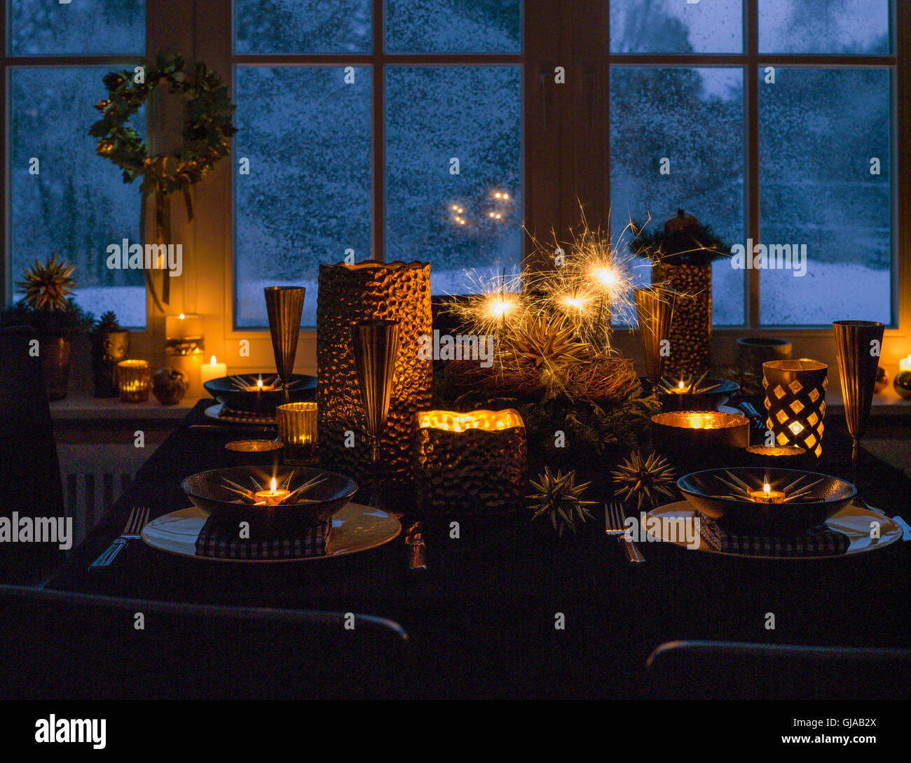 Christmassy table decorations with sparklers, evening Stock Photo