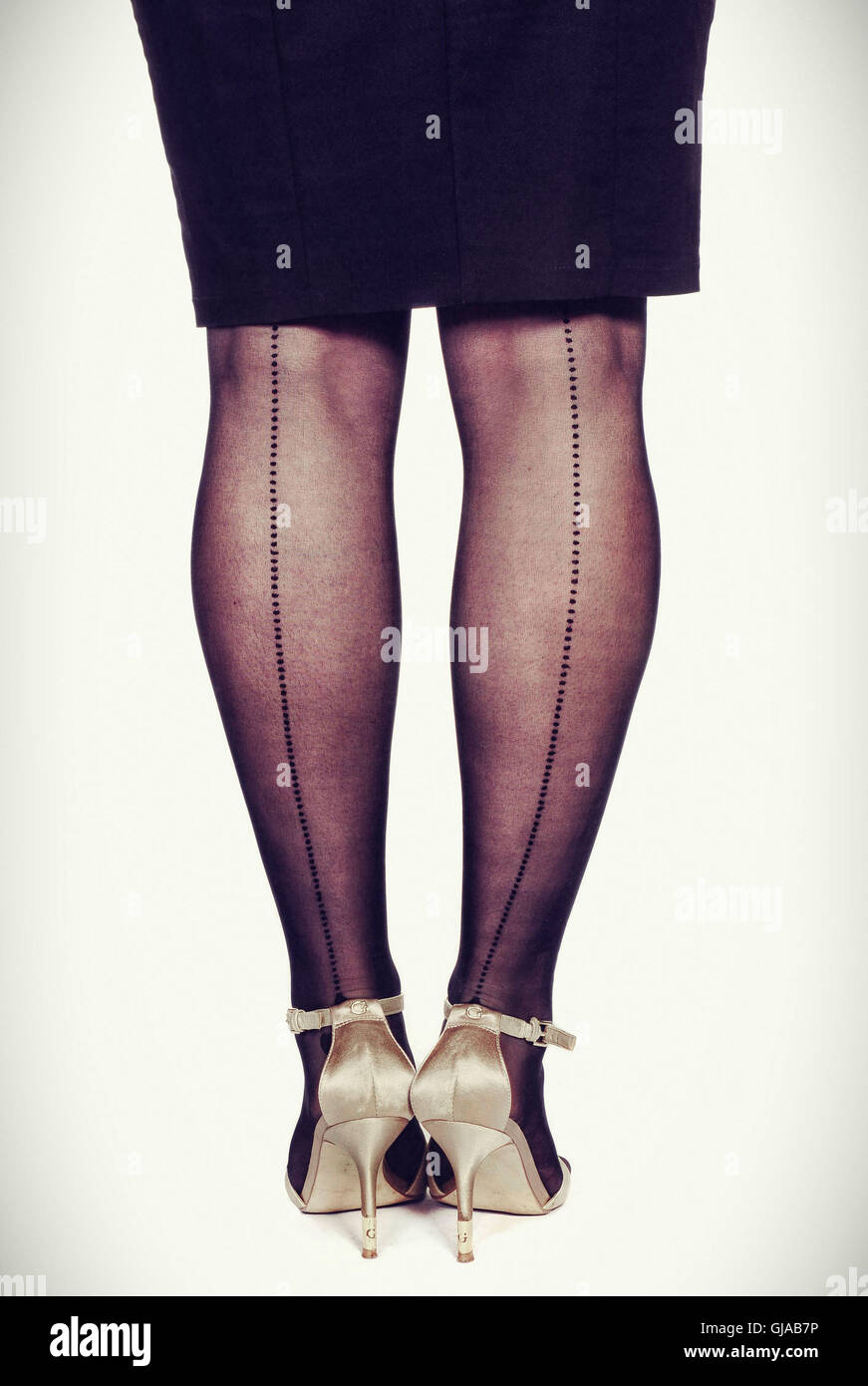 women's legs, skirt, black, nylon tights Stock Photo