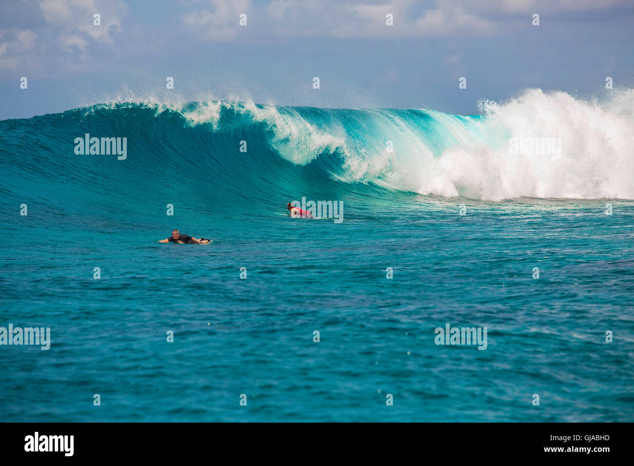 Surfer before plunging into a wave Stock Photo