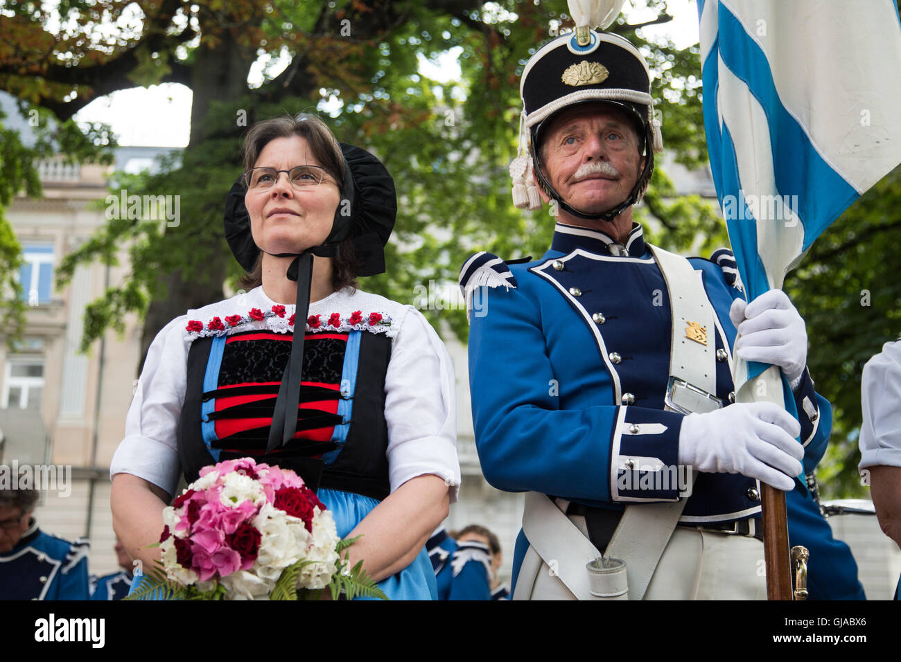 Men and women wear traditional dress at a ceremony in Zurich in celebration of Swiss National Day. Stock Photo