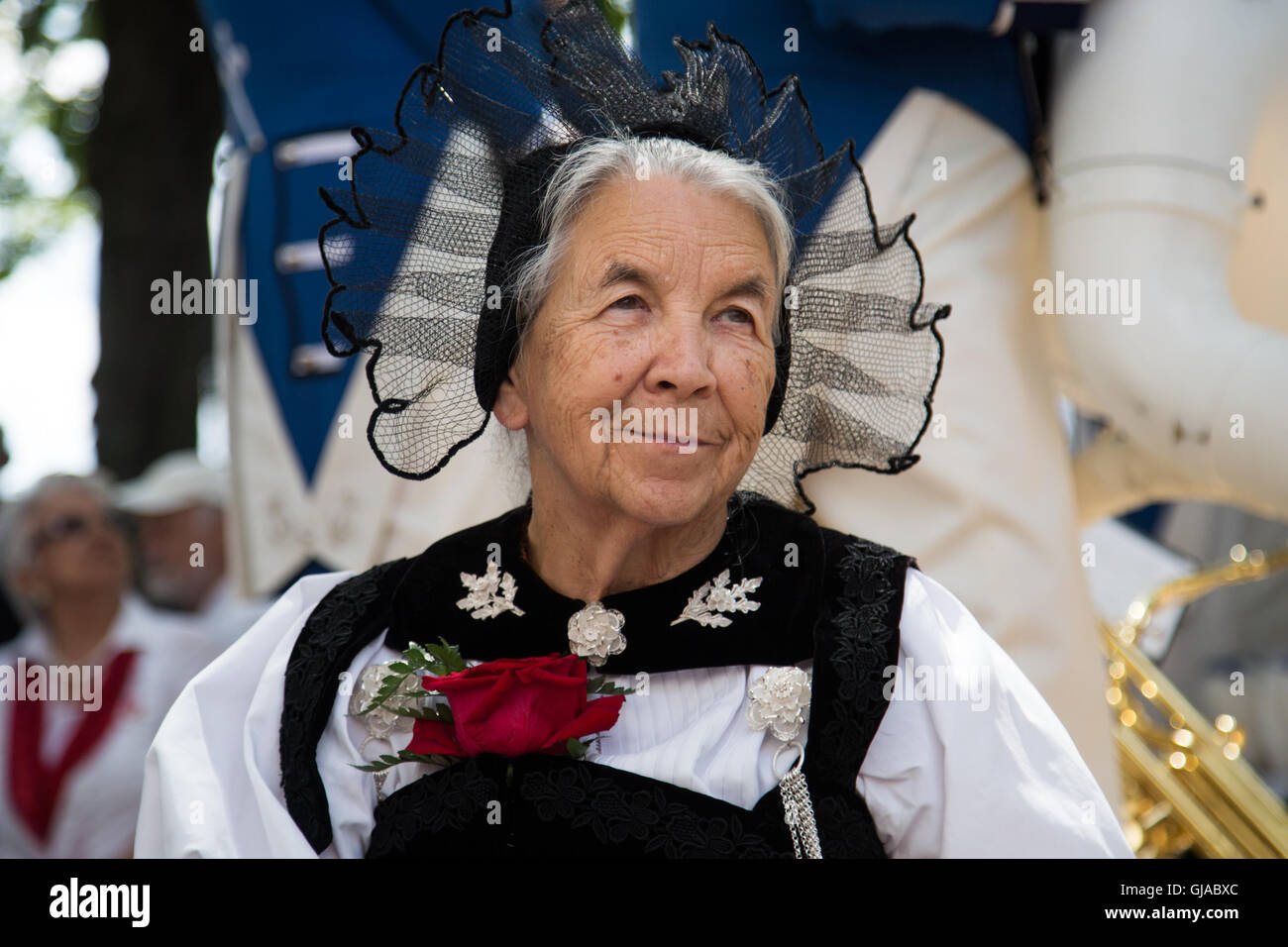 A woman wears traditional dress at a ceremony in Zurich in celebration of Swiss National Day. Stock Photo