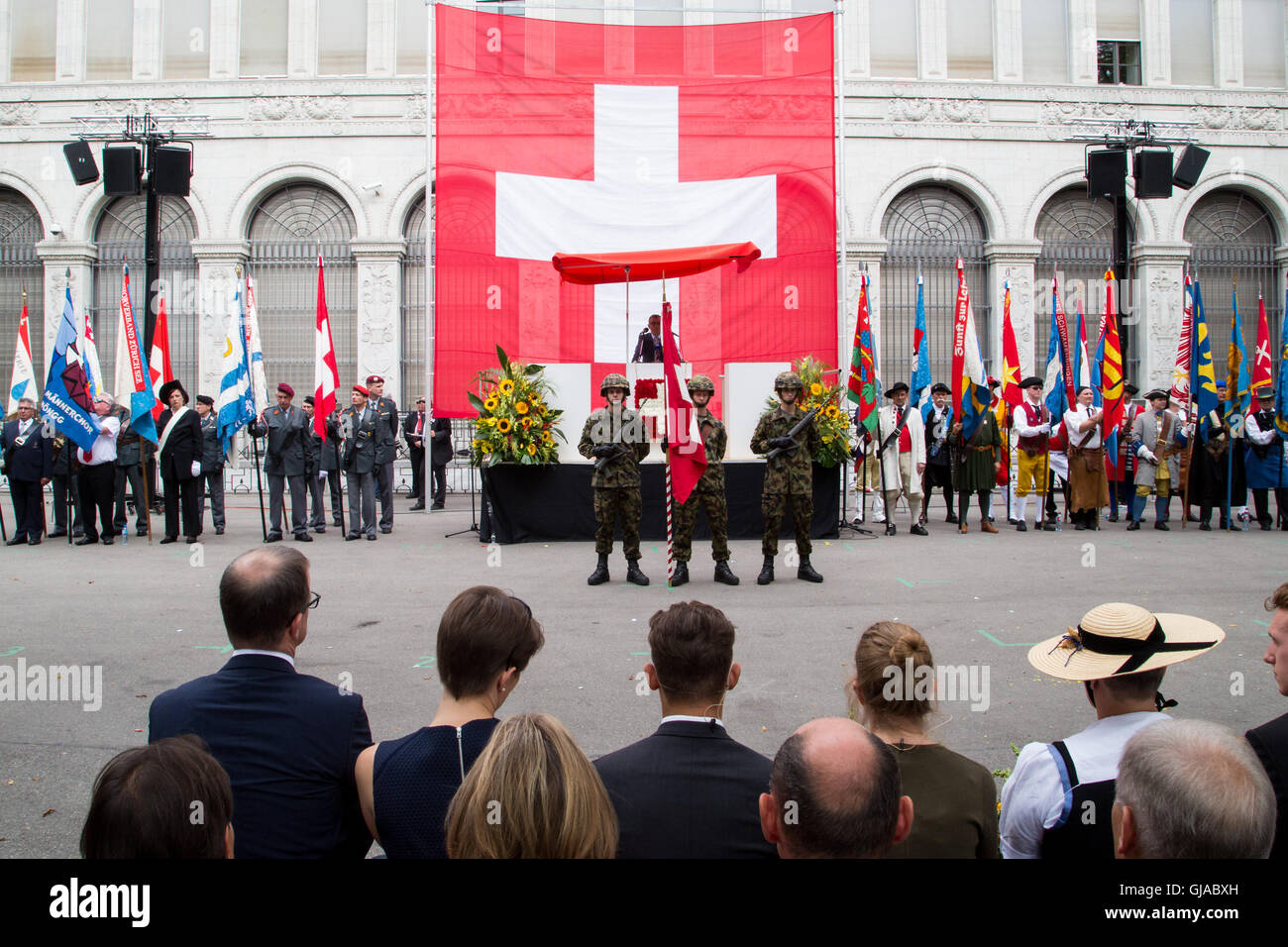 A huge Swiss flag on show at ceremony in Zurich in celebration of Swiss National Day. Stock Photo