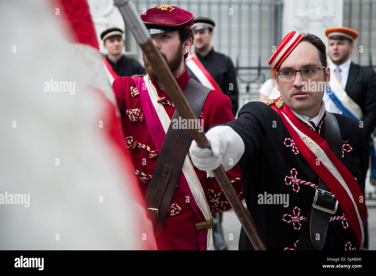 Flag bearers wear traditional dress at a ceremony in Zurich in celebration of Swiss National Day. Stock Photo