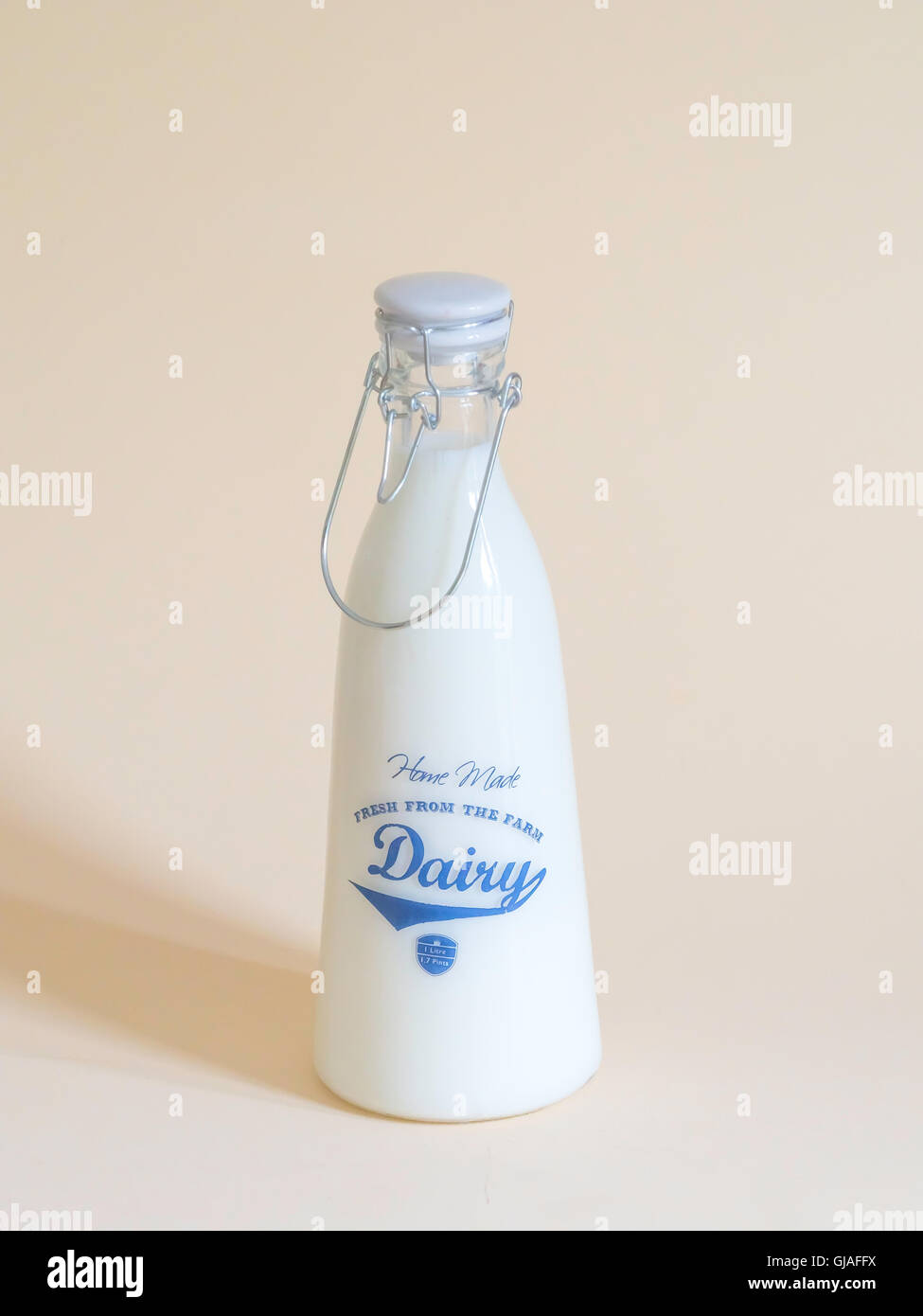 A one litre click top milk storage bottle inscribed Home Made Fresh from the farm Dairy Stock Photo