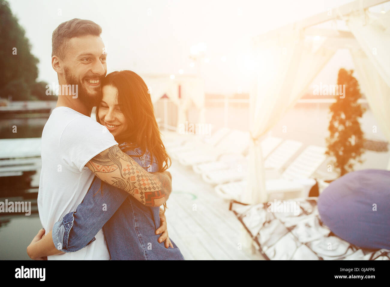 guy hugging his woman Stock Photo - Alamy
