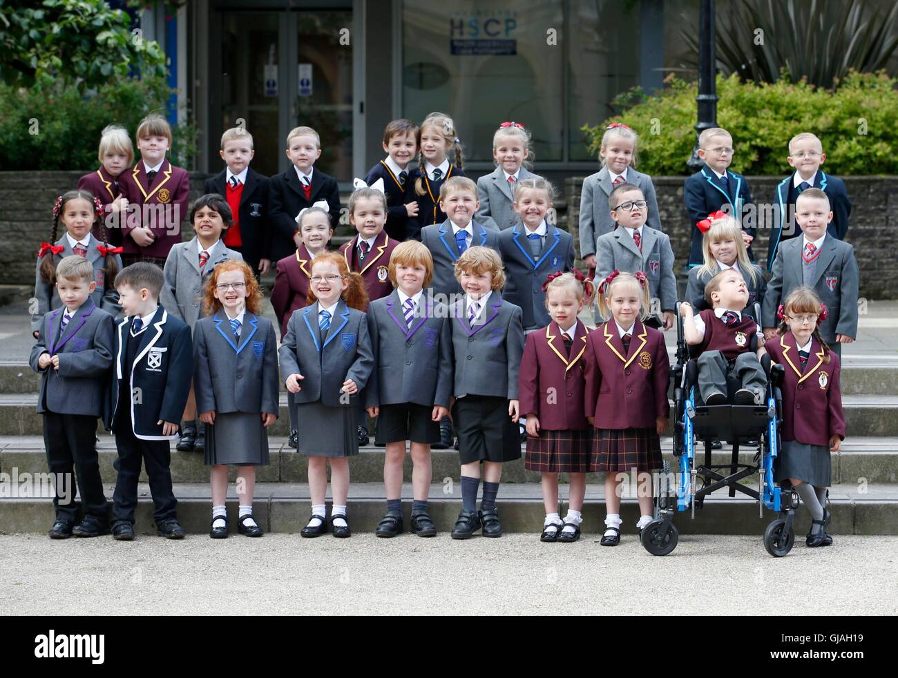 15 sets of twins, from the Inverclyde area, pose for a photograph in Clyde Square in Greenock, ahead of their first day at school. Pictured are (back row left to right) Emma and Grace McEleny (4), Fraser and Nathan McGrath (5), Jackson and Elizabeth Reid (5), Brooke and Skye Smith (4), Andrew and Thomas Stewart (4), (middle row left to right) Charlotte and Morgan Goyal (5), Orlagh and Niamh Keen (4), Charlie and Olivia Lyne (5), Cameron MacKenzie and Caitlin MacKenzie (NOT PICTURED) (4), Olivia and Rhogen McCurry (5), (front row left to right) Craig and Stuart Arthur (5), Caragh and Sophie Stock Photo