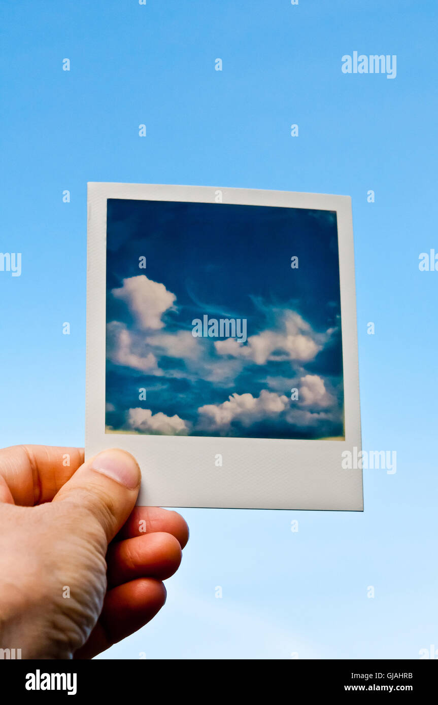hand holding a Polaroid photo Stock Photo - Alamy