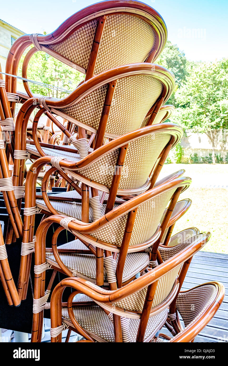 stacked wicker chairs Stock Photo