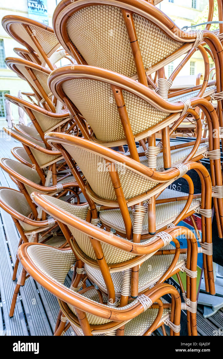 stacked wicker chairs Stock Photo