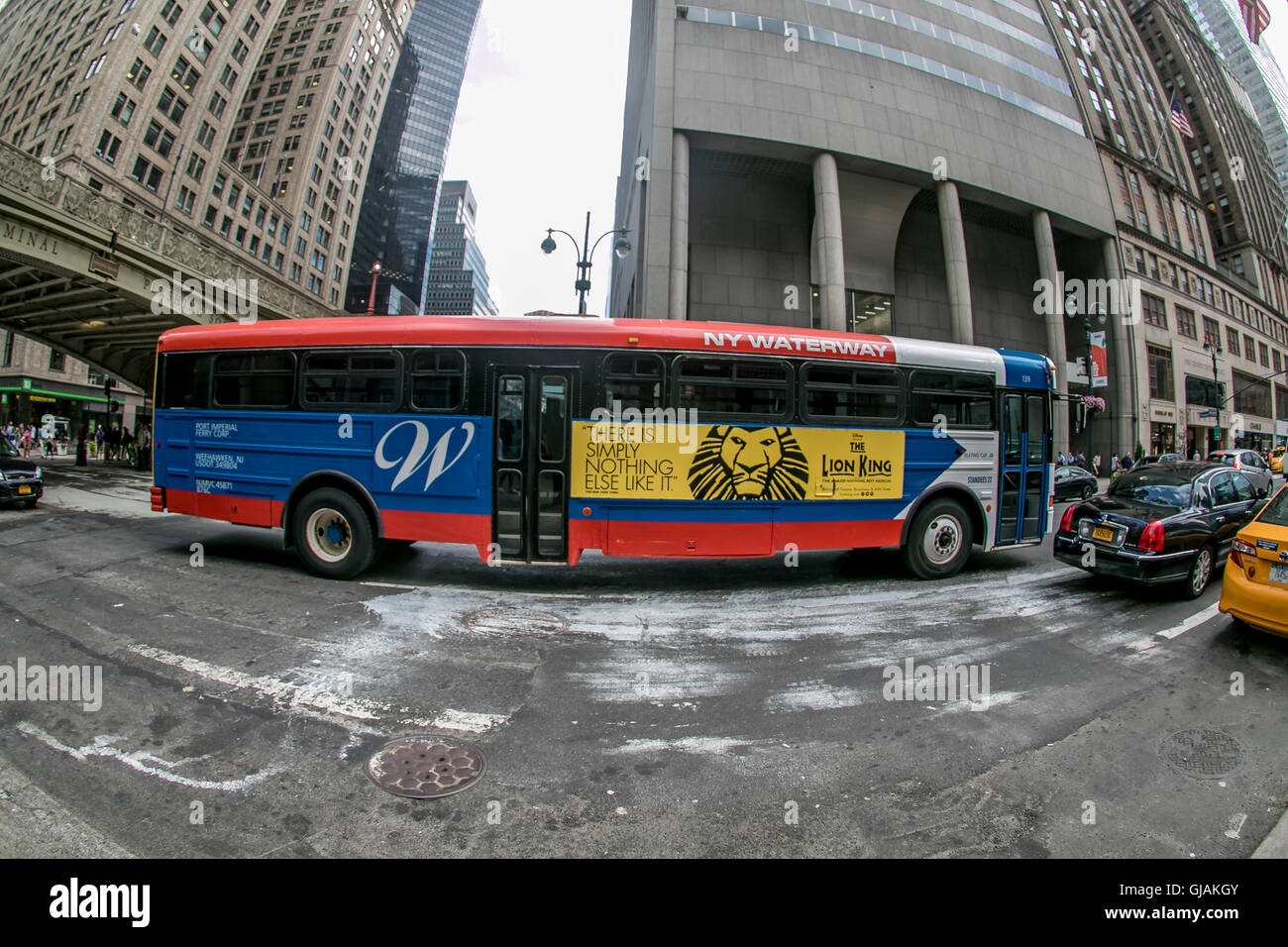 NY Waterway bus is moving along 42nd street near Grand Central station. Stock Photo