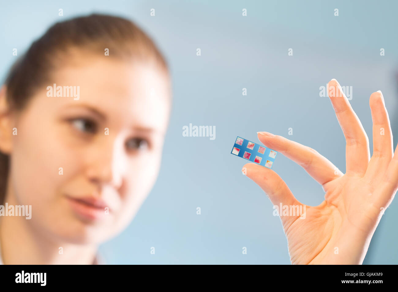 DNA microarray, DNA chip or biochip, array of nano DNA spots attached to a glass surface to measure levels of large numbers of g Stock Photo