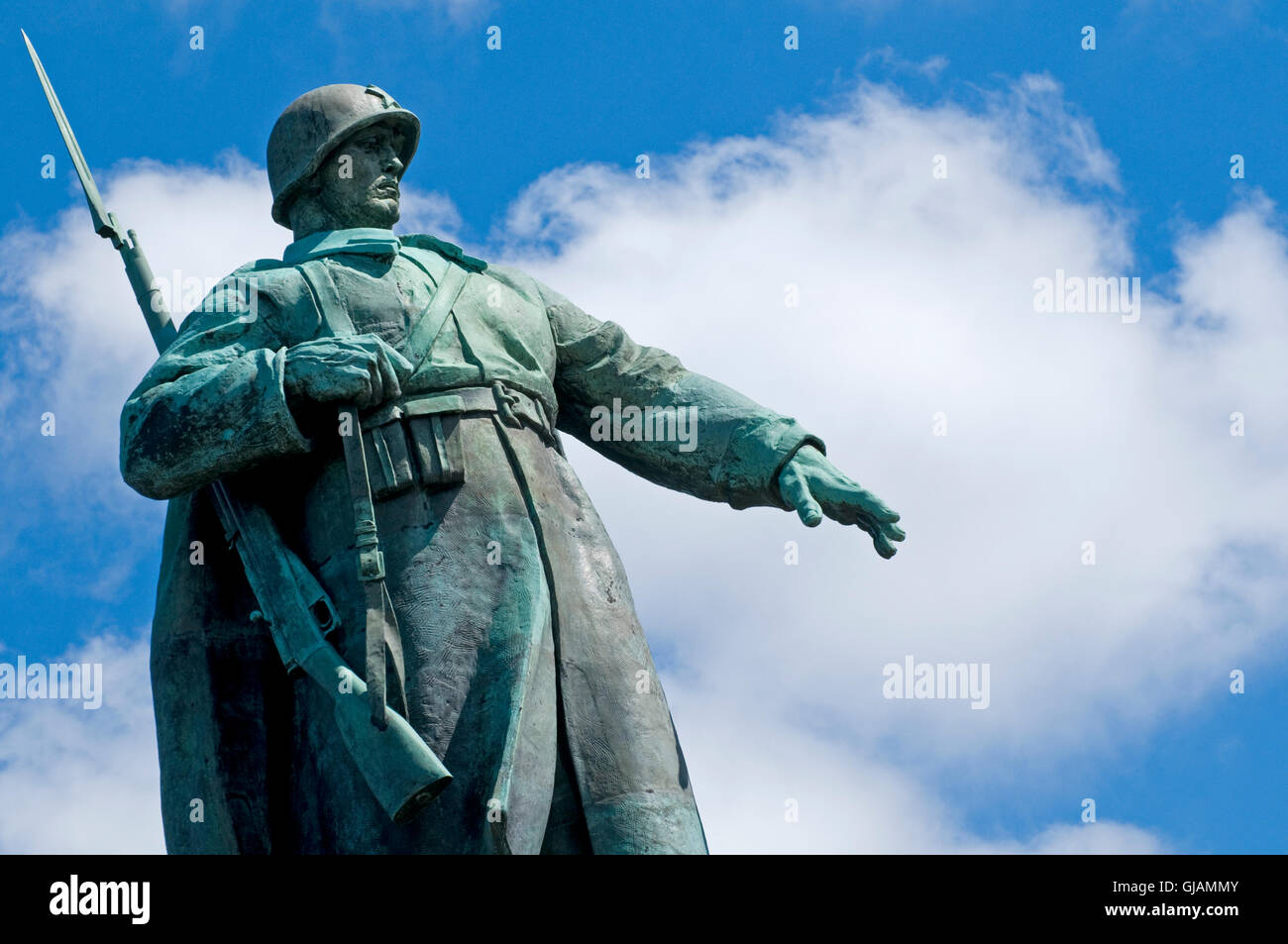 The imposing statue of a soldier atop the Soviet War Memorial in the Tiergarten, Berlin, Germany. Stock Photo