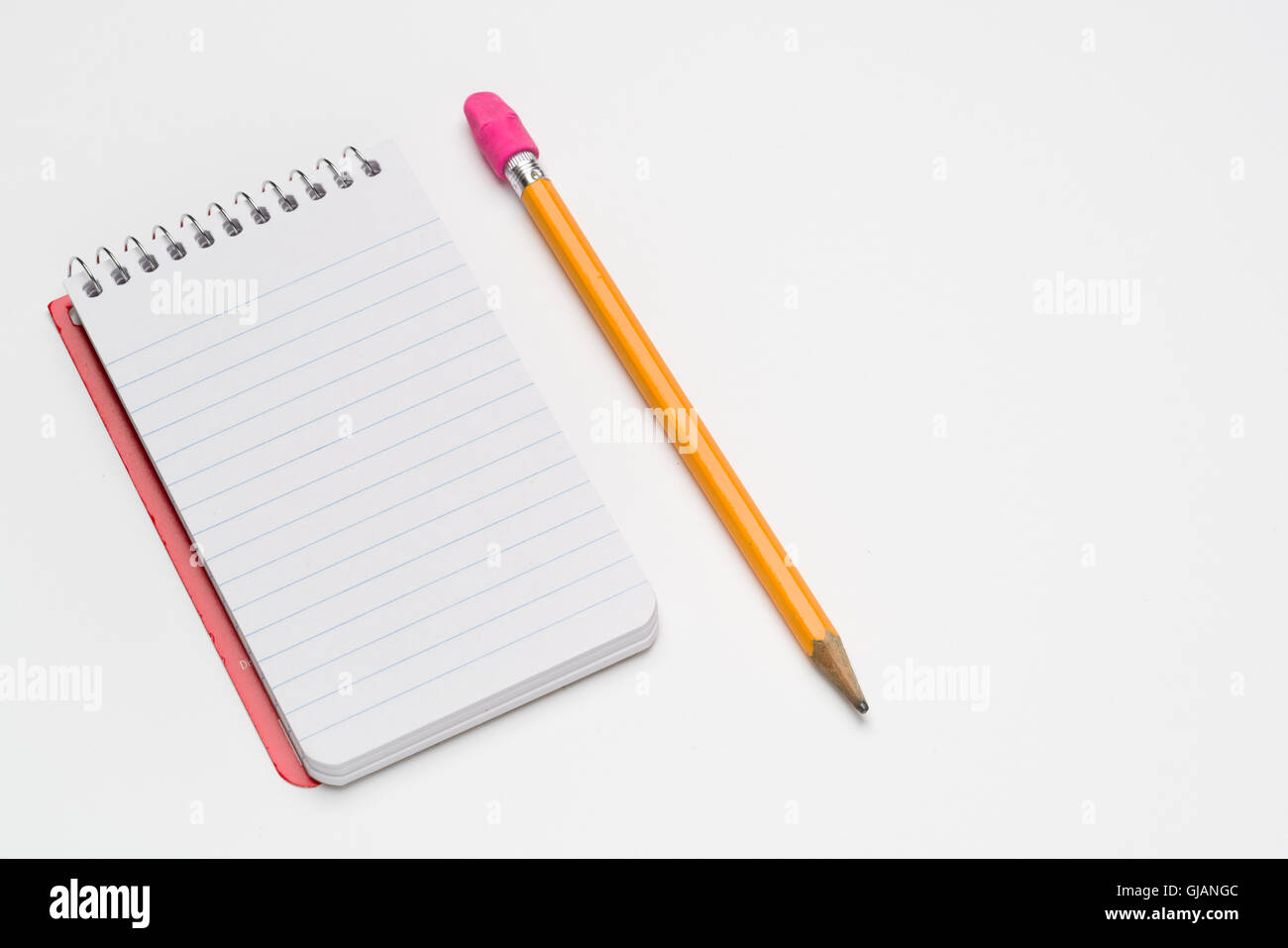 Pocket size spiral notebook on a white background Stock Photo