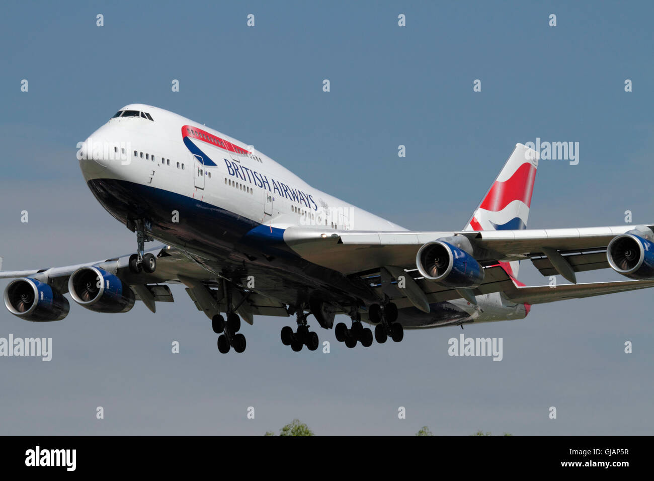 BA or British Airways Boeing 747-400 four engine airliner, known as the jumbo jet, approaching London Heathrow after a long haul flight Stock Photo