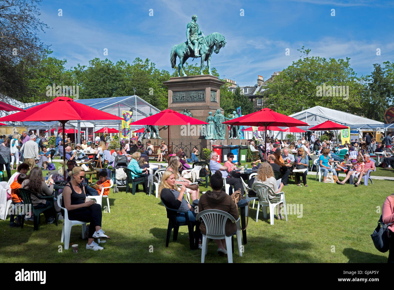 Visitors to the annual Edinburgh Book Festival enjoying the sunshine in Charlotte Square. Stock Photo