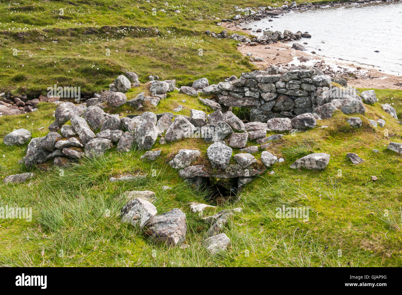 Remains of Norse style click mill at Loch Camasord near Crowlista in the Isle of Lewis. Stock Photo