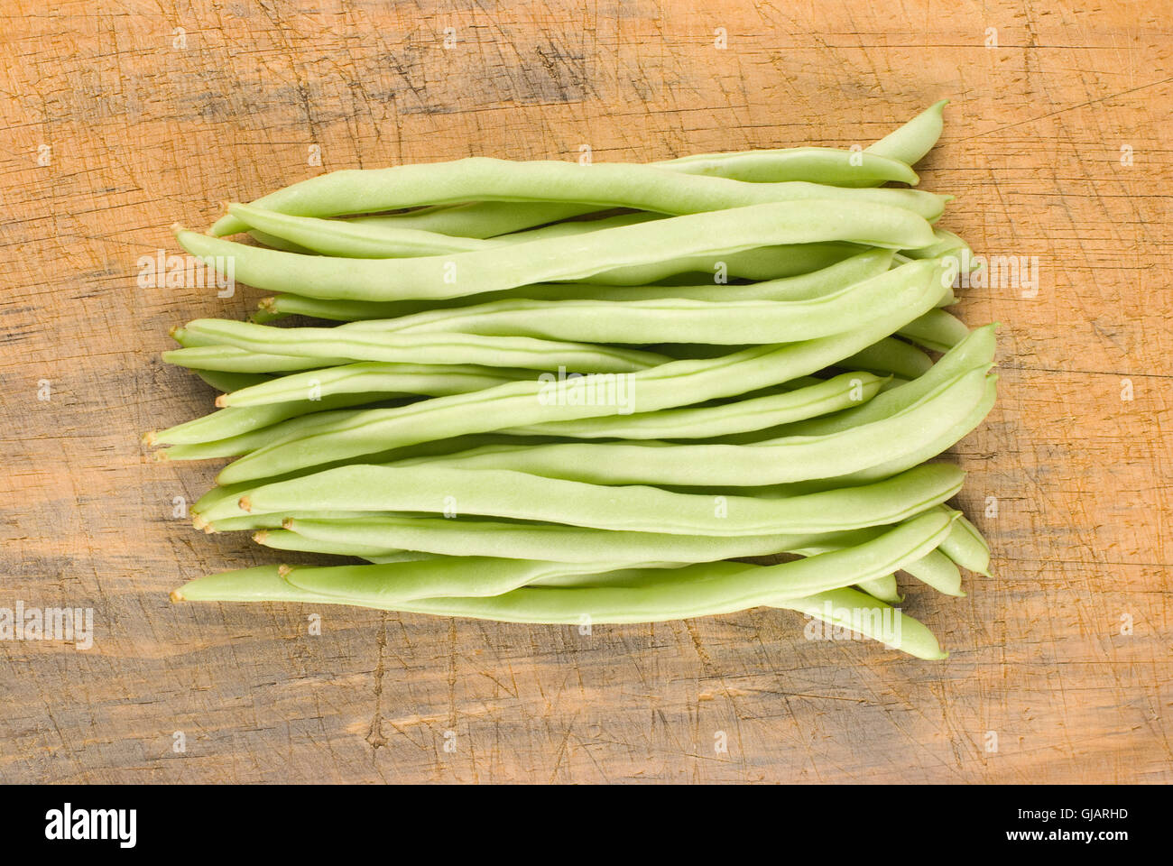 String bean and cutting board Stock Photo - Alamy