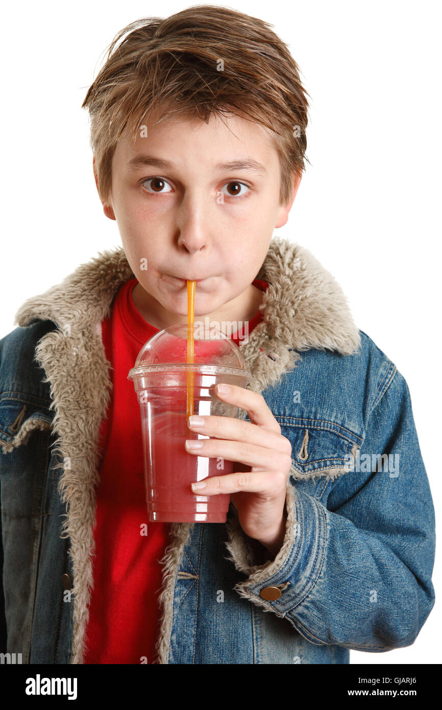 Child drinking fresh fruit juice through a straw Stock Photo Alamy