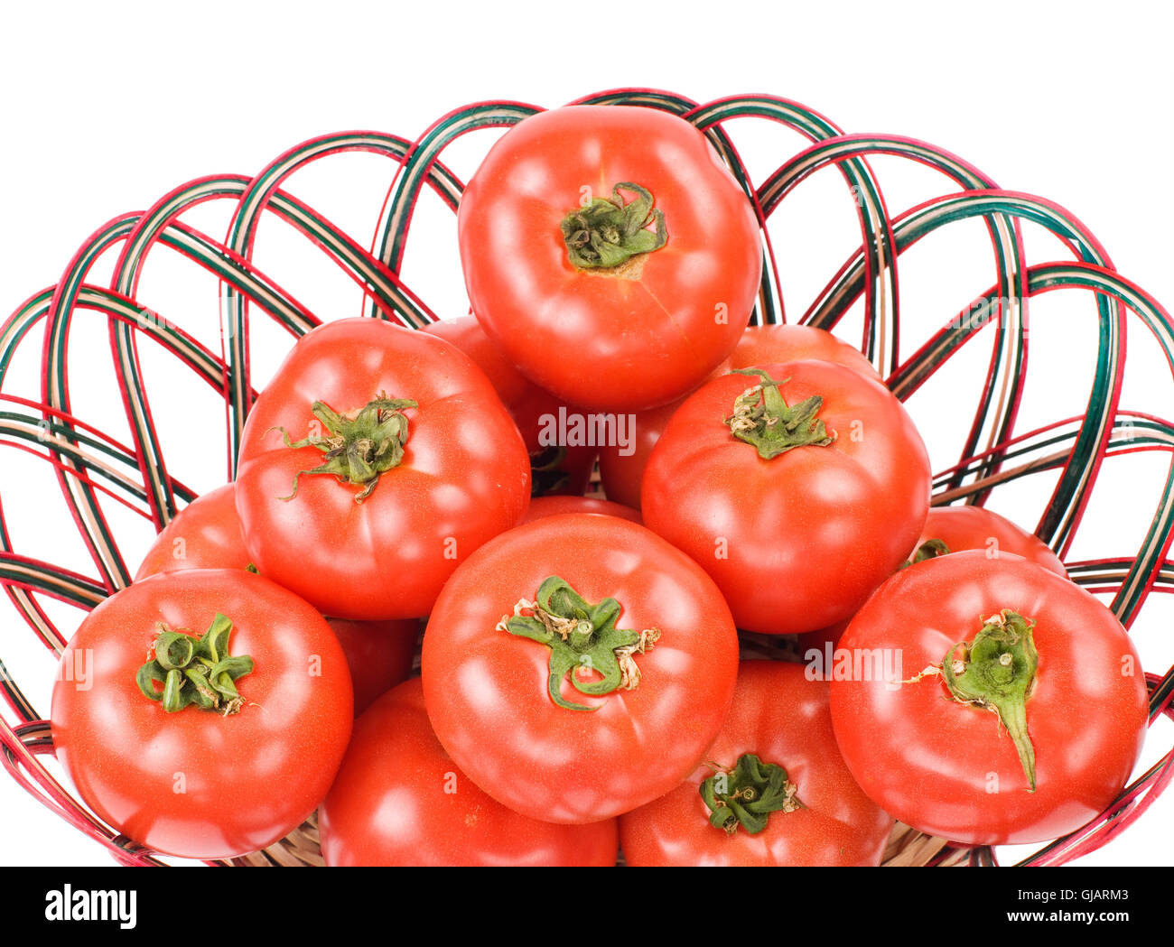 Red tomatoes in bamboo basket Stock Photo - Alamy