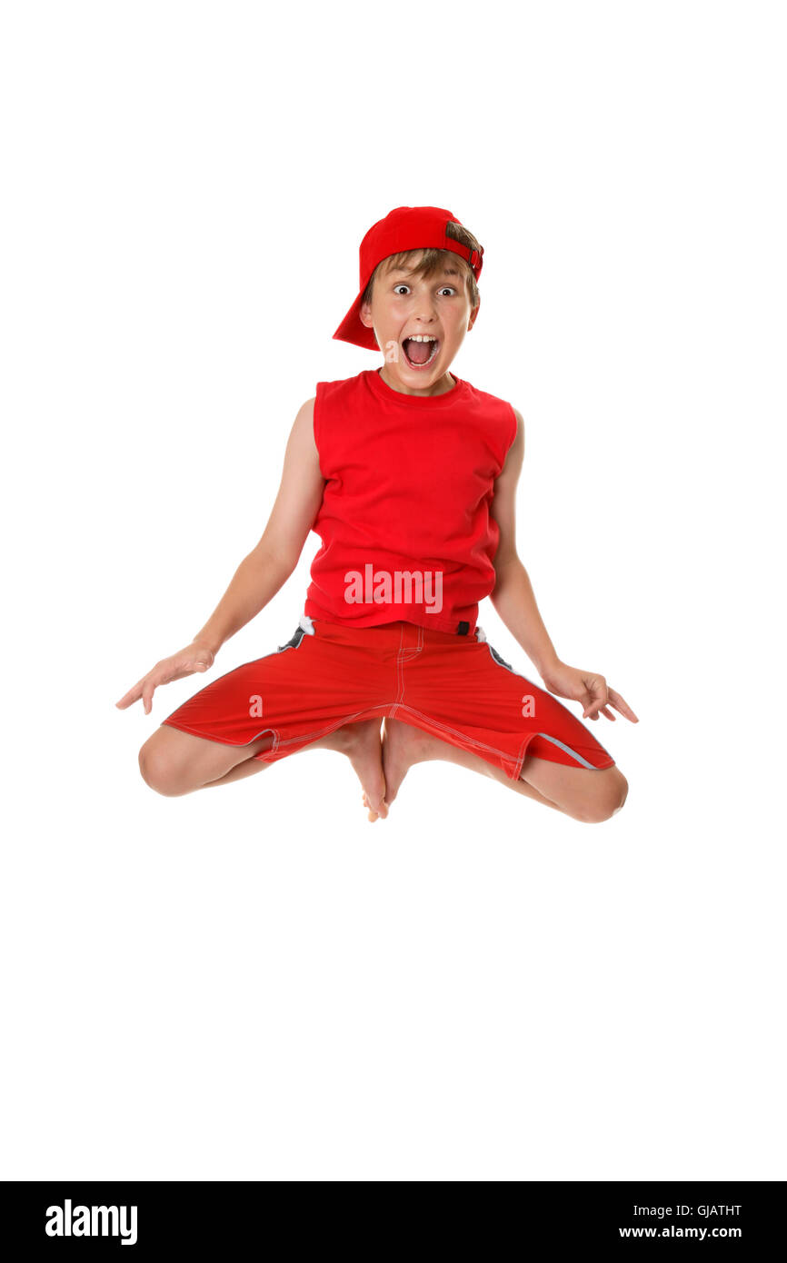 Excited boy jumping off the ground Stock Photo Alamy