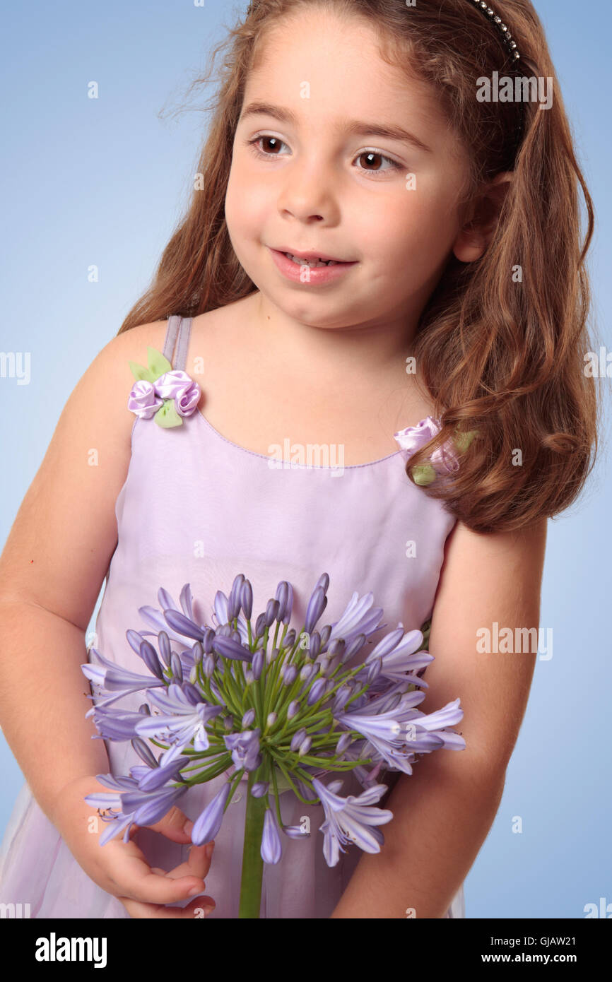 Sweet girl with lily flower Stock Photo Alamy