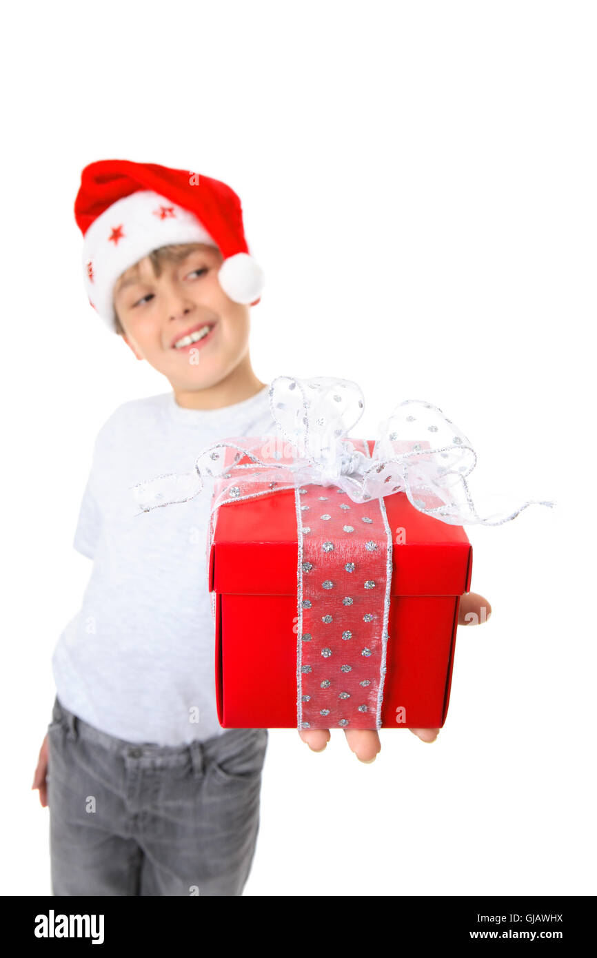 Boy with present looking sideways Stock Photo Alamy