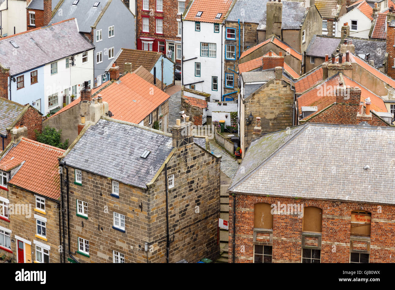 High view looking down onto rooftops of houses. In Staithes, North