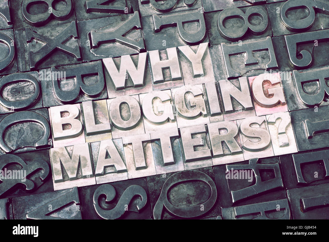 why blogging matters question made from metallic letterpress blocks with dark letters background Stock Photo