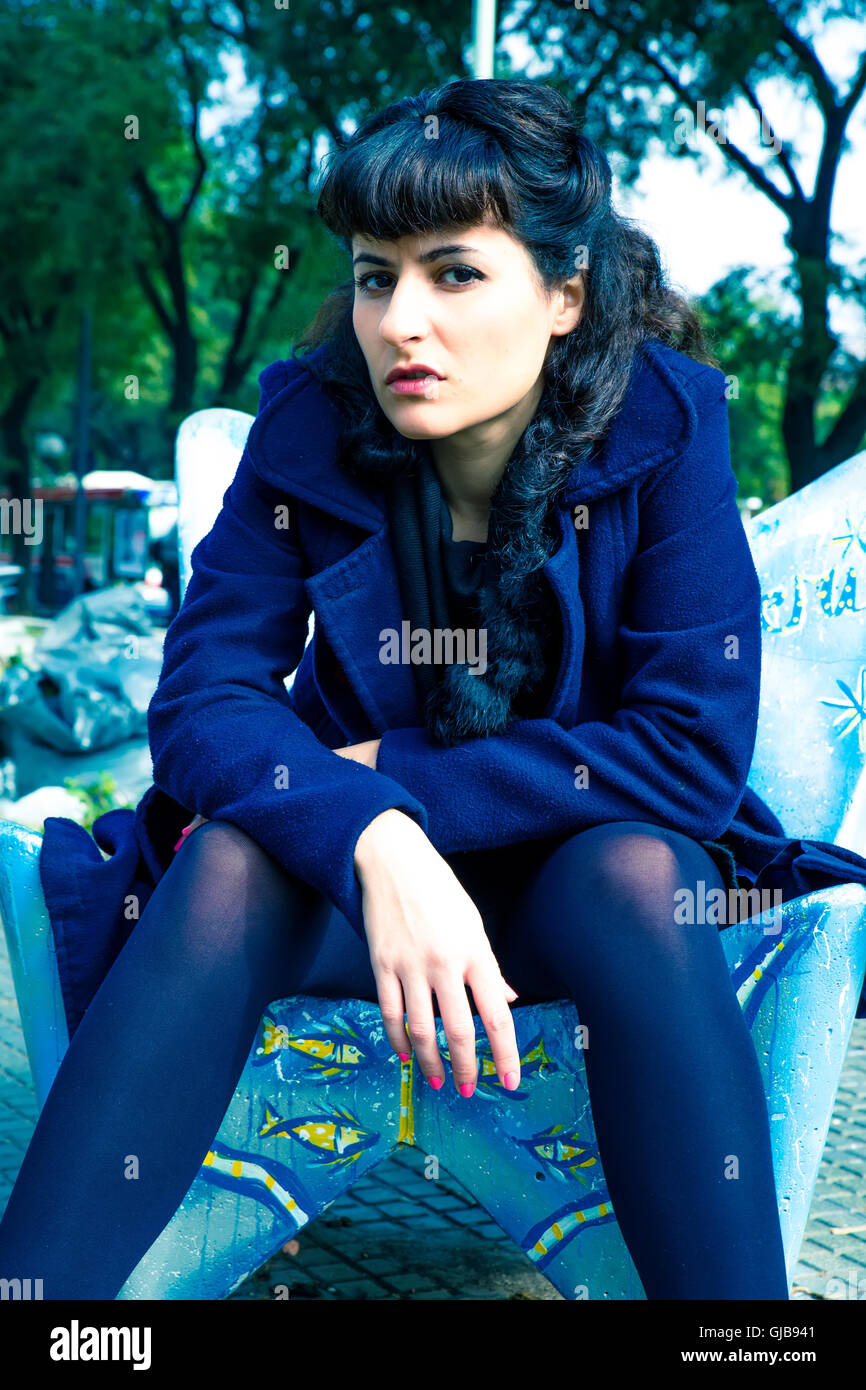 A retro styled girl being bored in a urban environment Stock Photo - Alamy