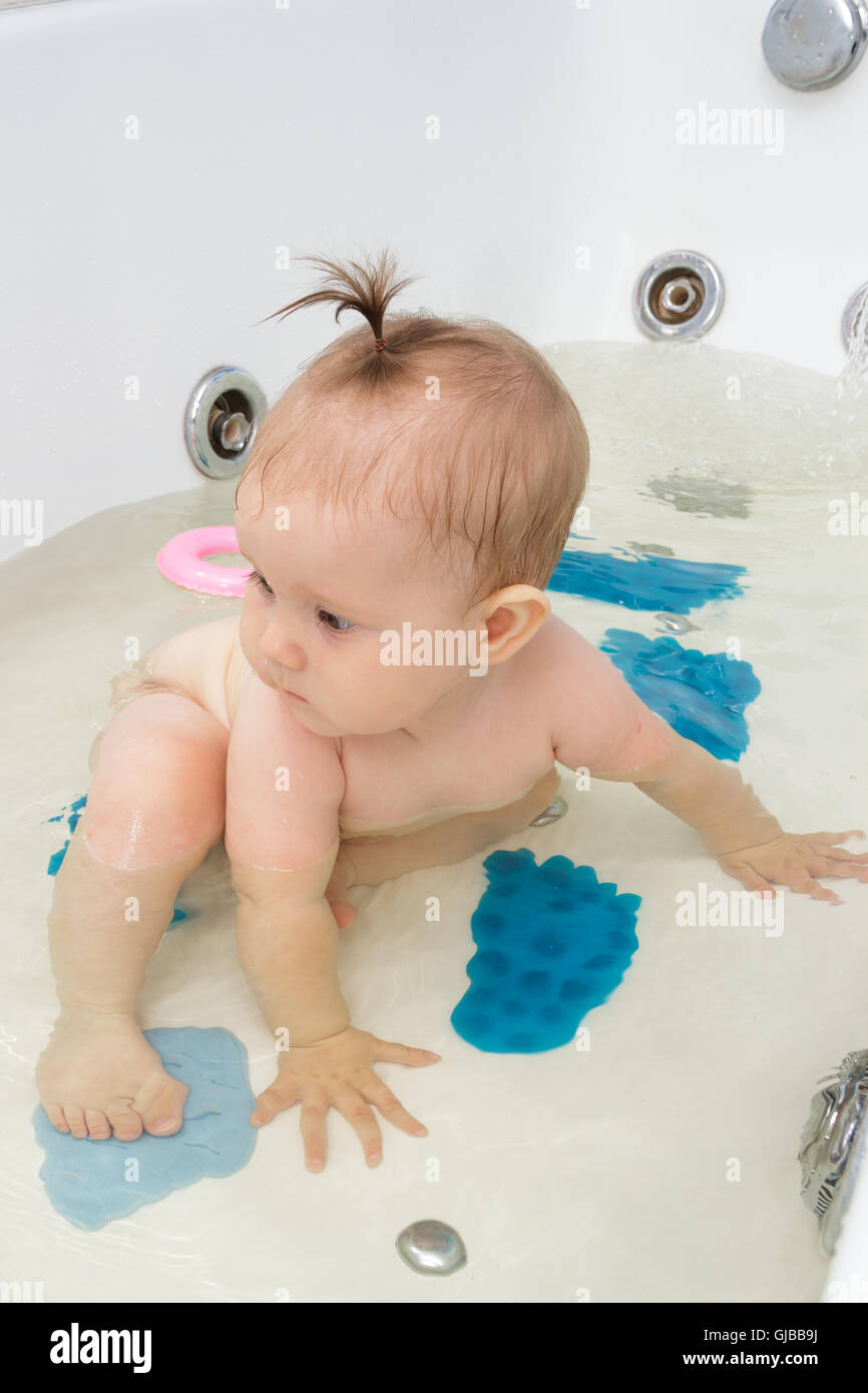 Little newborn baby girl bathe, swim and wash Stock Photo Alamy