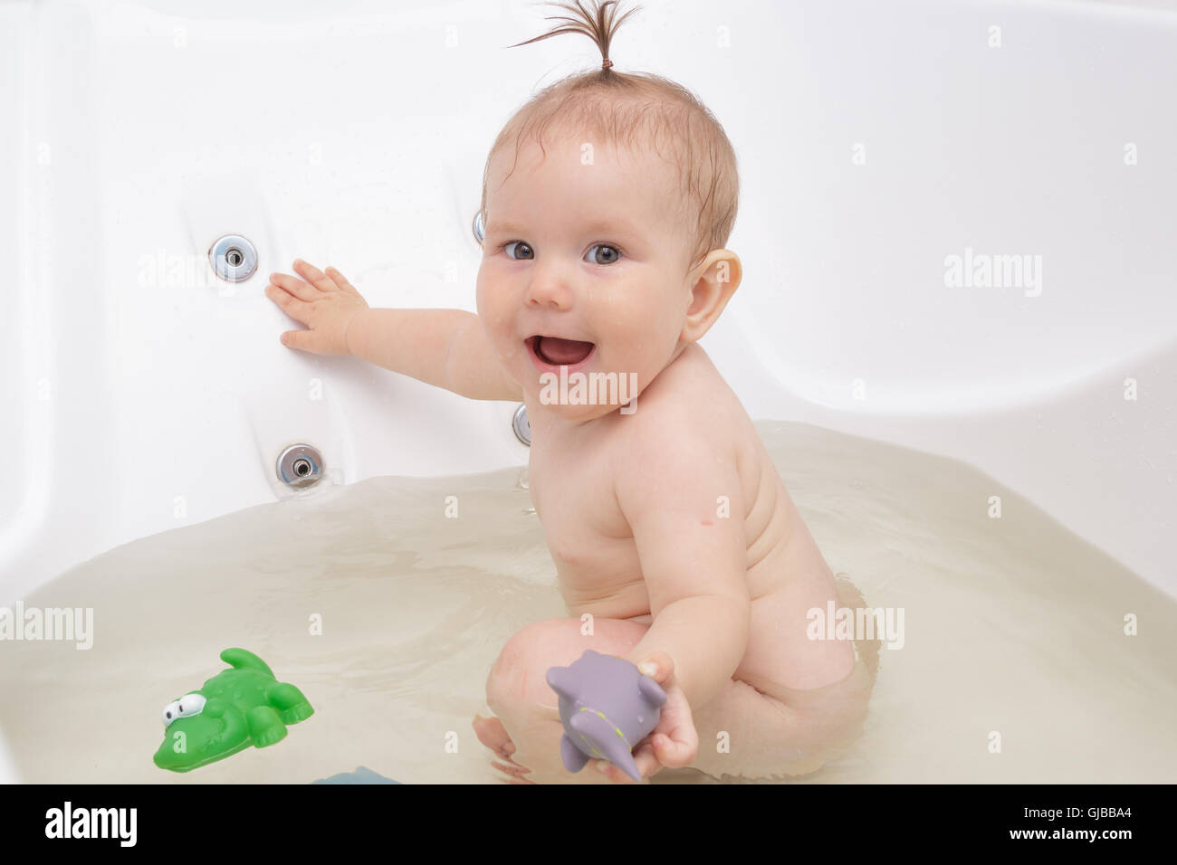 Little newborn baby girl bathe, swim and wash Stock Photo Alamy