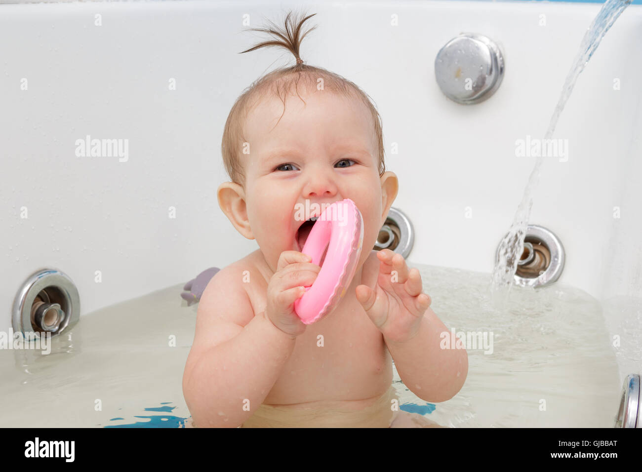 Little newborn baby girl bathe, swim and wash Stock Photo Alamy