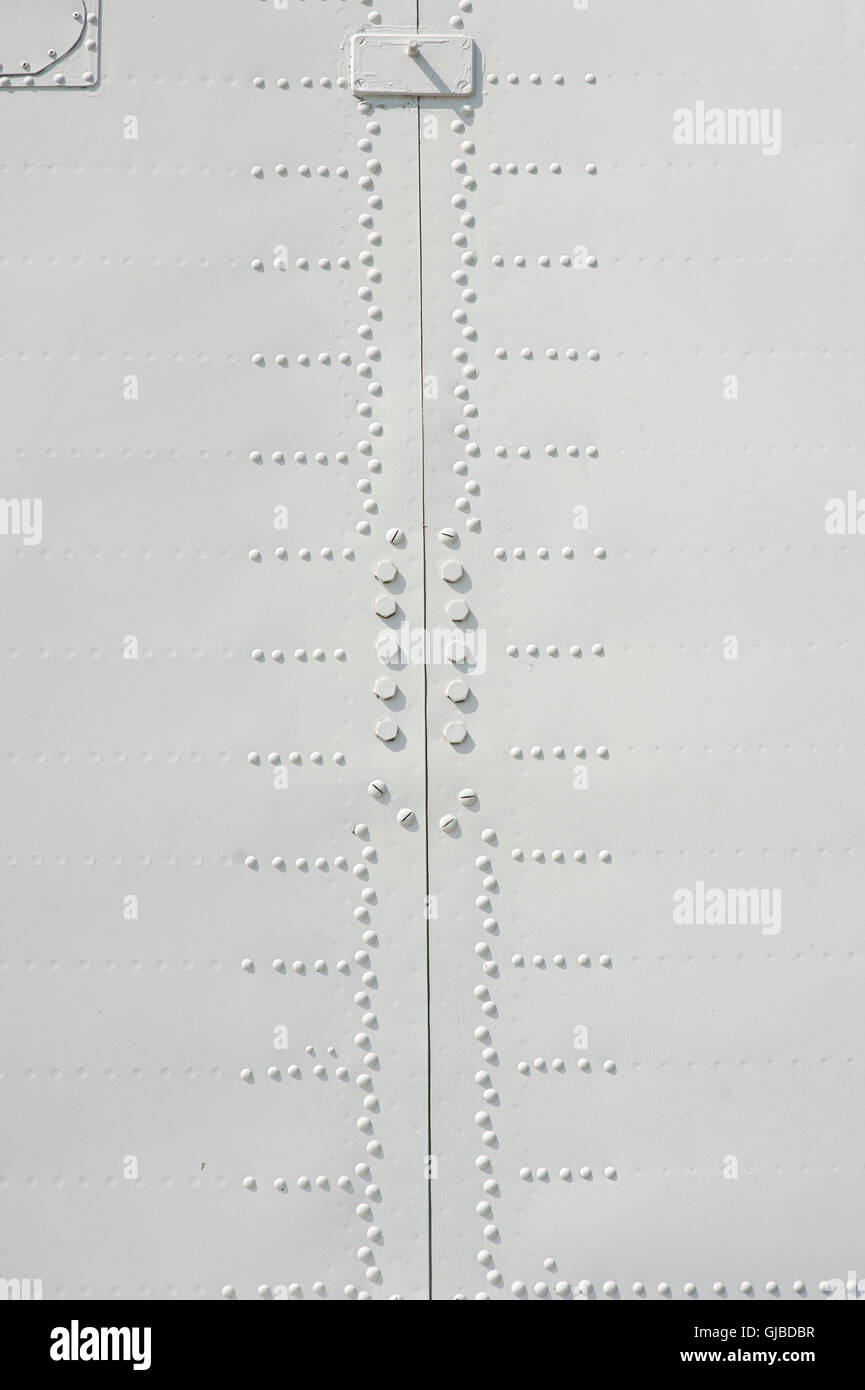 Aluminum fuselage and rivets on old airplane Stock Photo