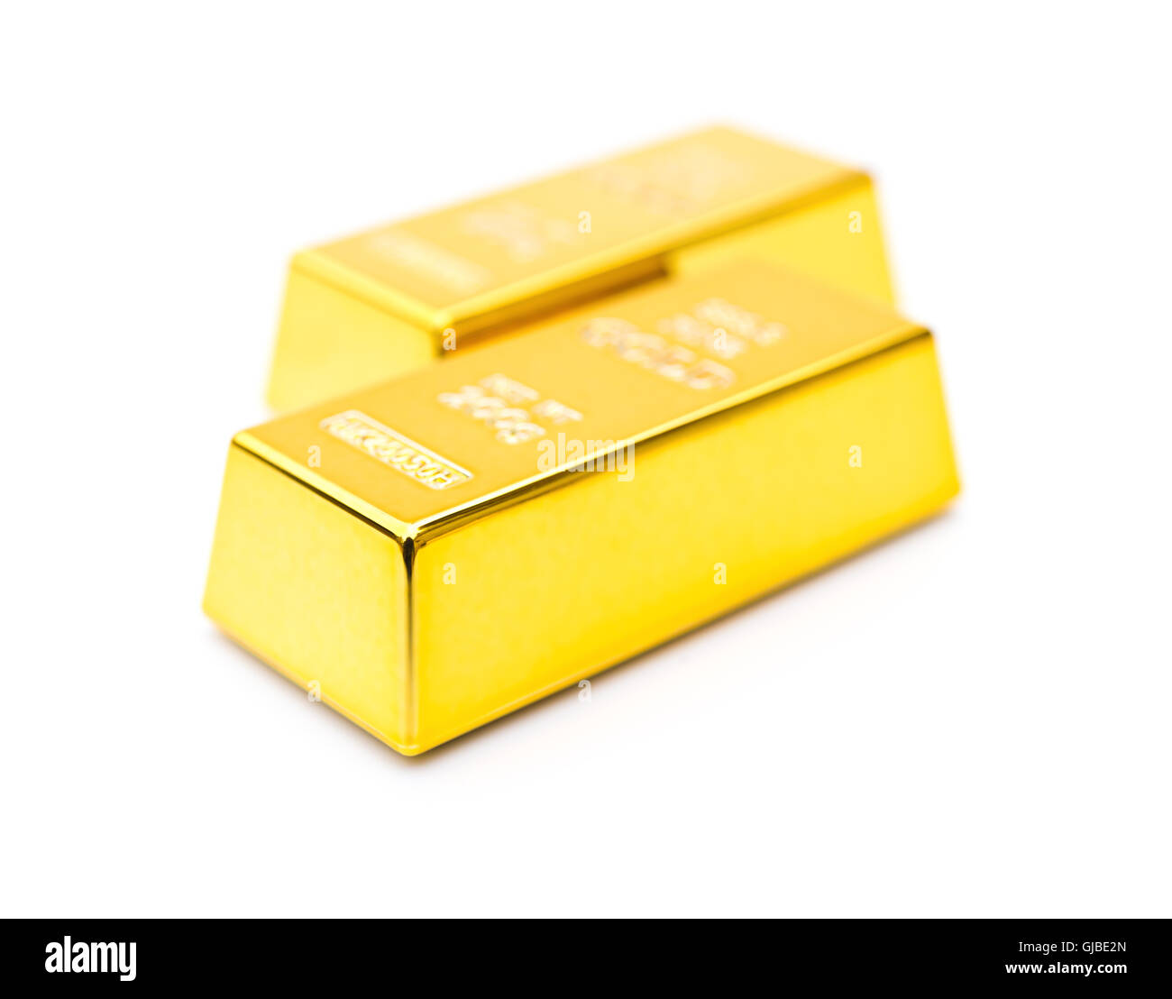 two pieces of gold bar on a white background Stock Photo - Alamy