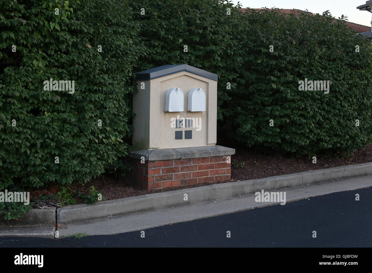 Mailboxes shrubs businesses curb USPS Stock Photo Alamy