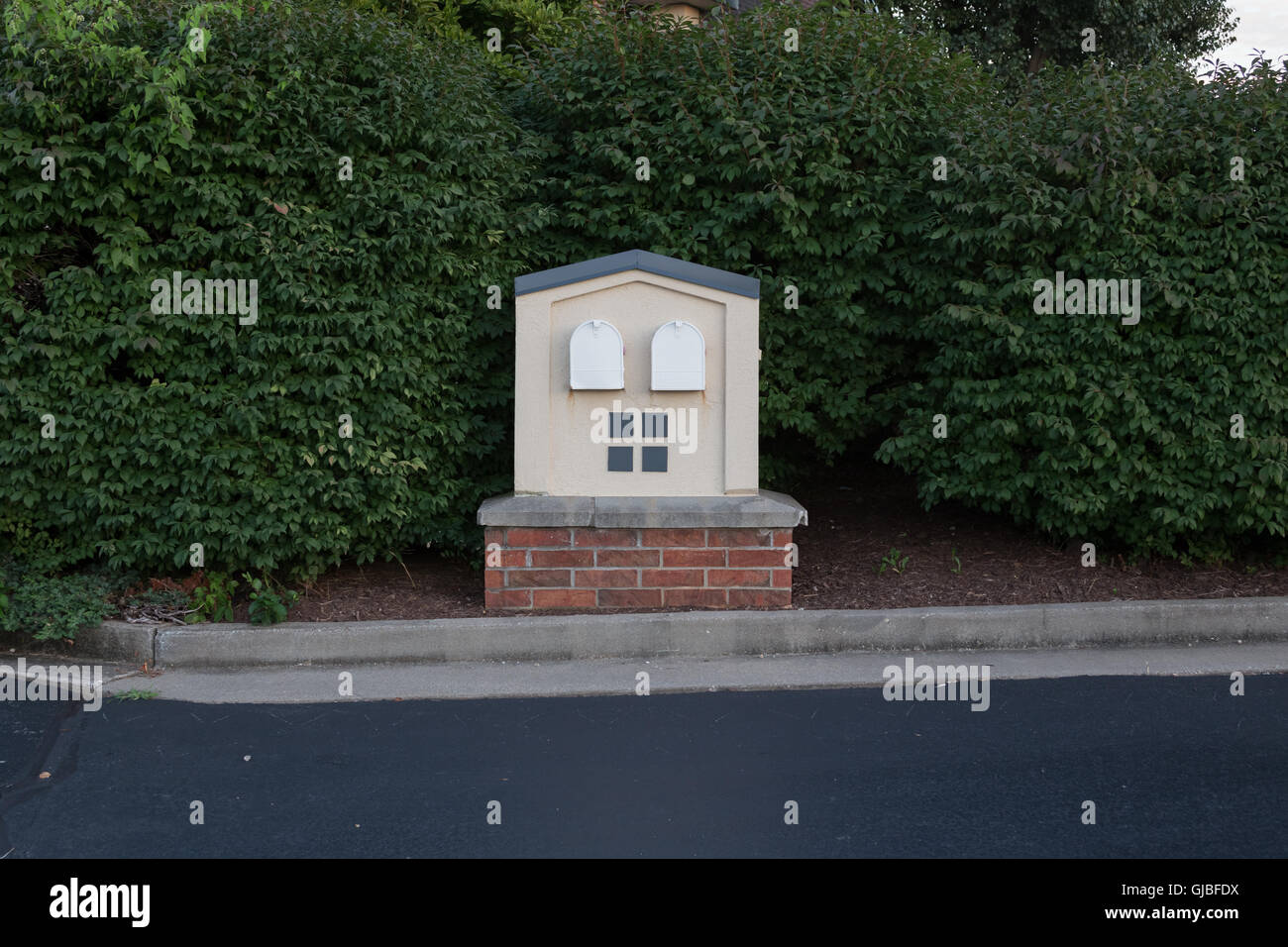 Mailboxes shrubs businesses curb USPS Stock Photo Alamy