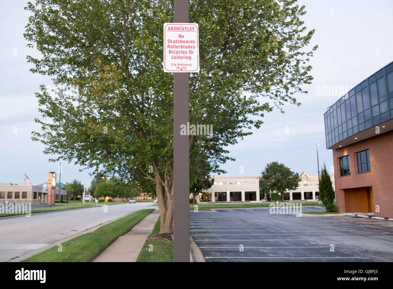 Sign prohibiting skateboards, rollerblades, bicycles and loitering. Stock Photo