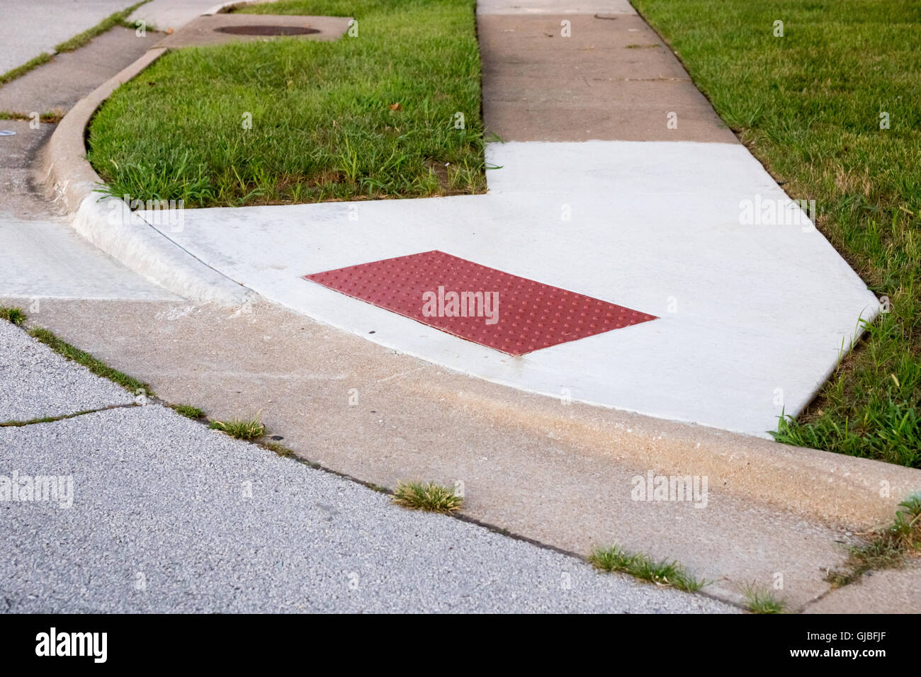 Sidewalk with handicap ramp rubber traction corner Stock Photo Alamy