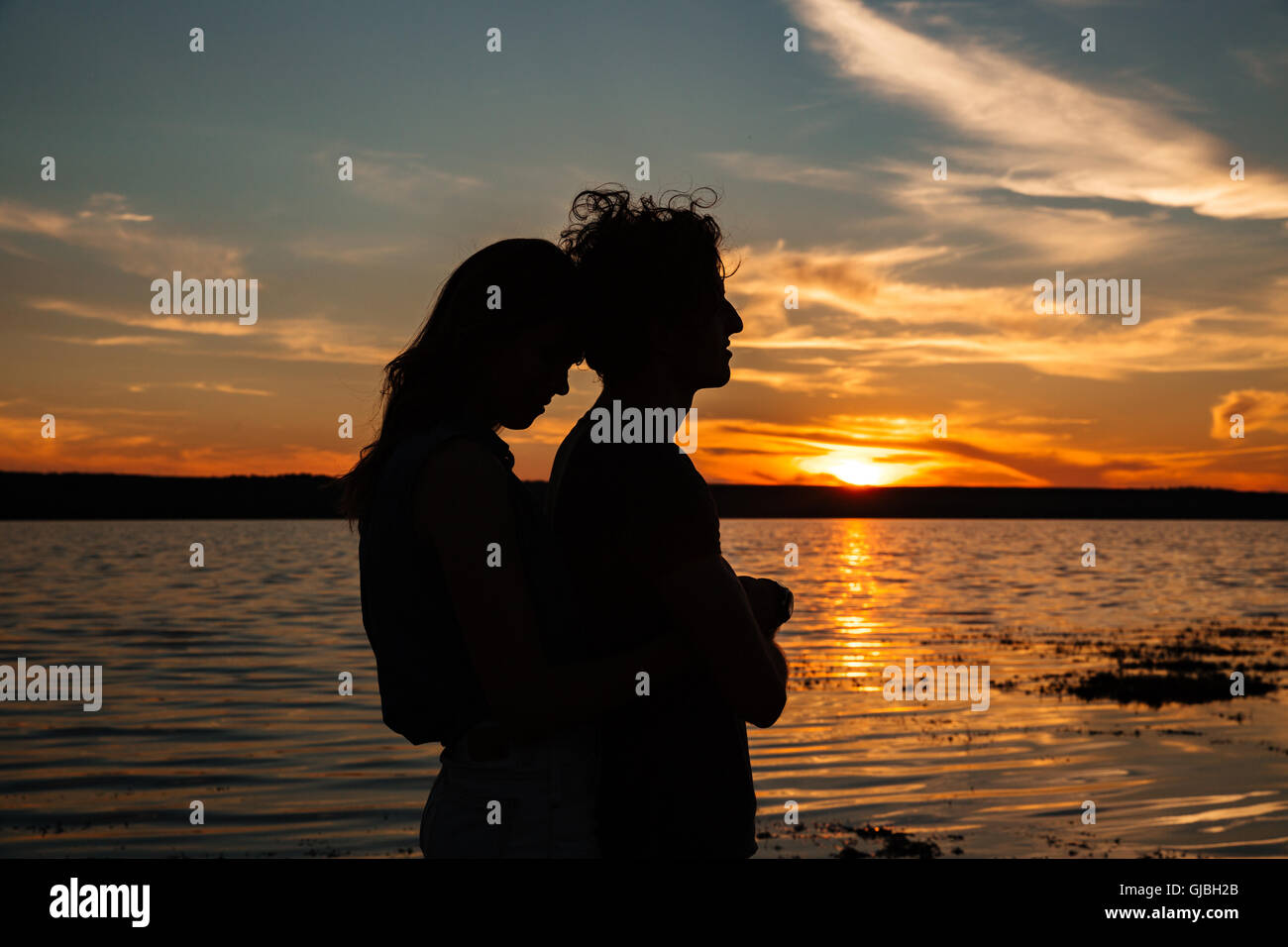 Silhouette of woman hugging hi-res stock photography and images - Alamy