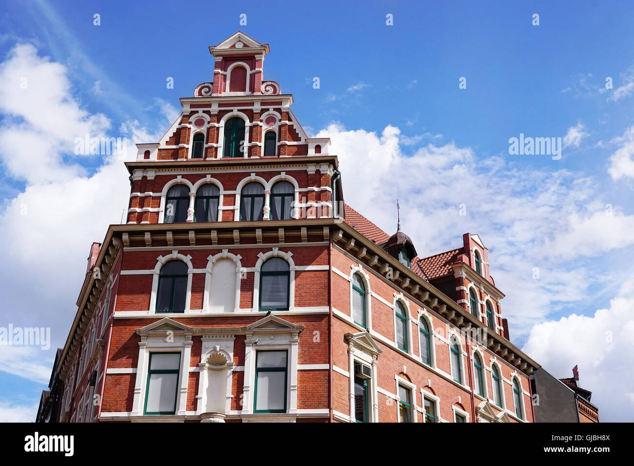 restored red brick historicist building in Germany Stock Photo